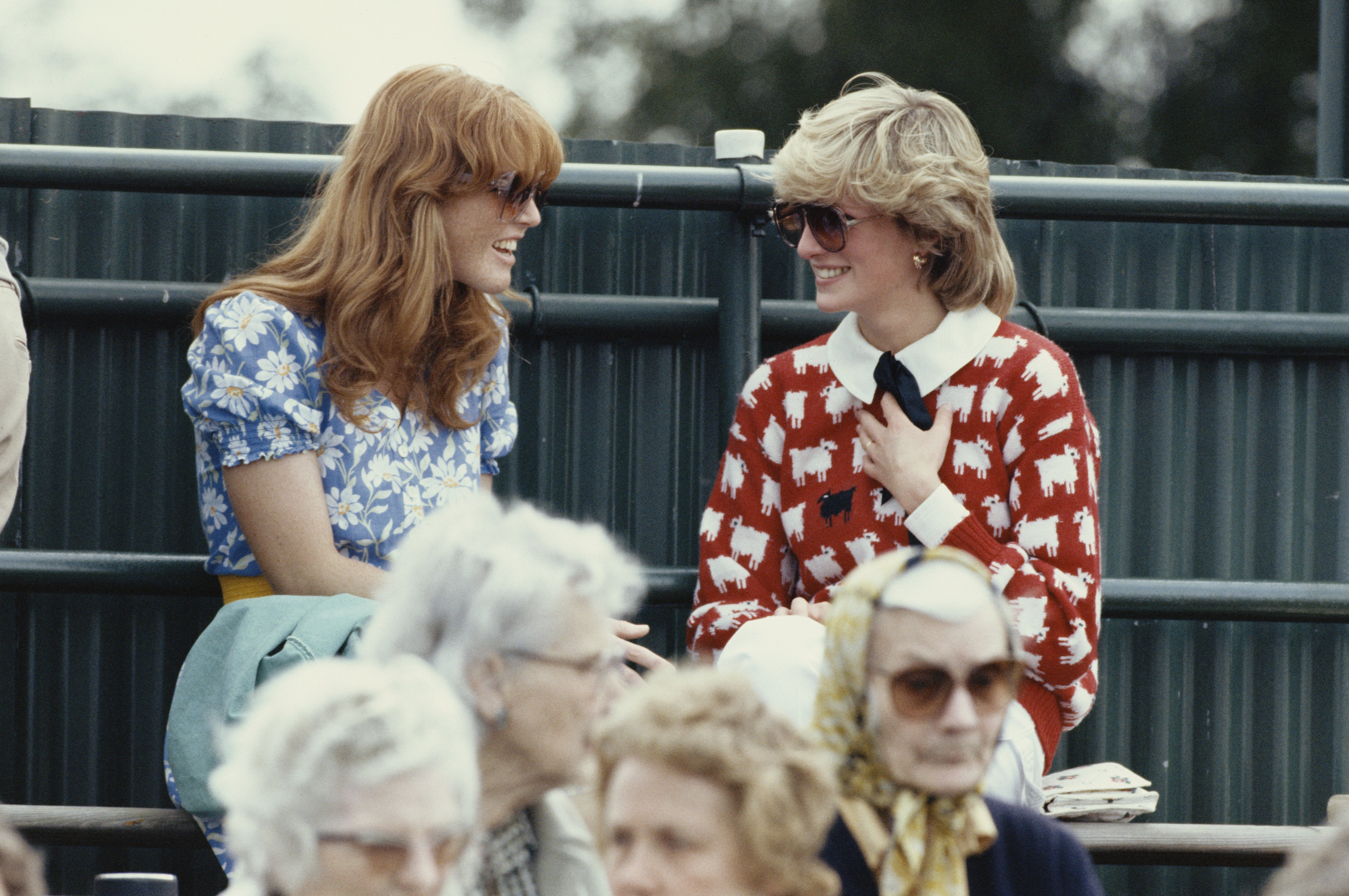 Princess Diana and Sarah Ferguson enjoy a chat while sitting in the crowd at the Guard's Polo Club, on June 1 1983, Windsor, England | Source: Georges De Keerle/Getty Images