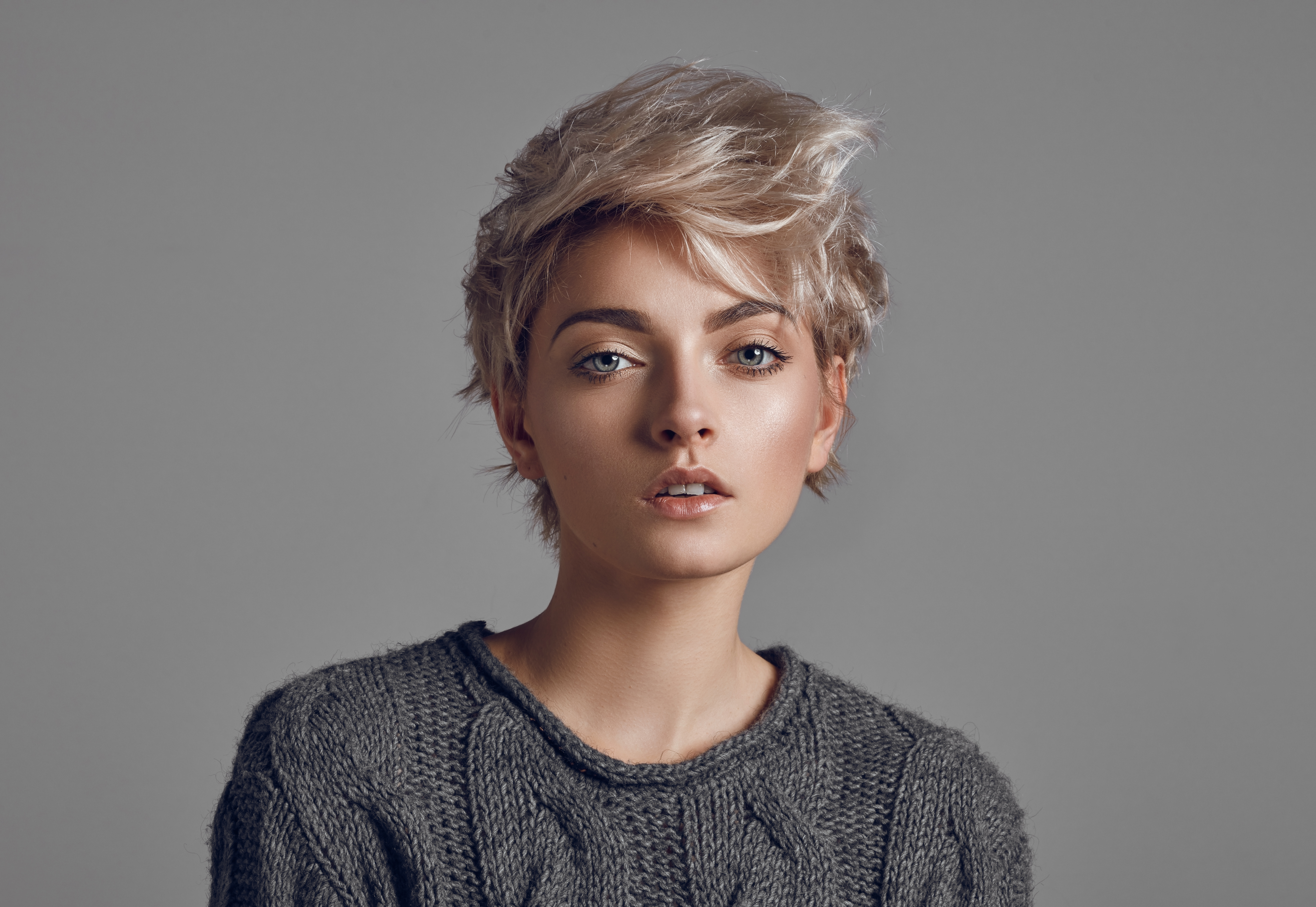 A young woman with short, blond hair | Source: Shutterstock