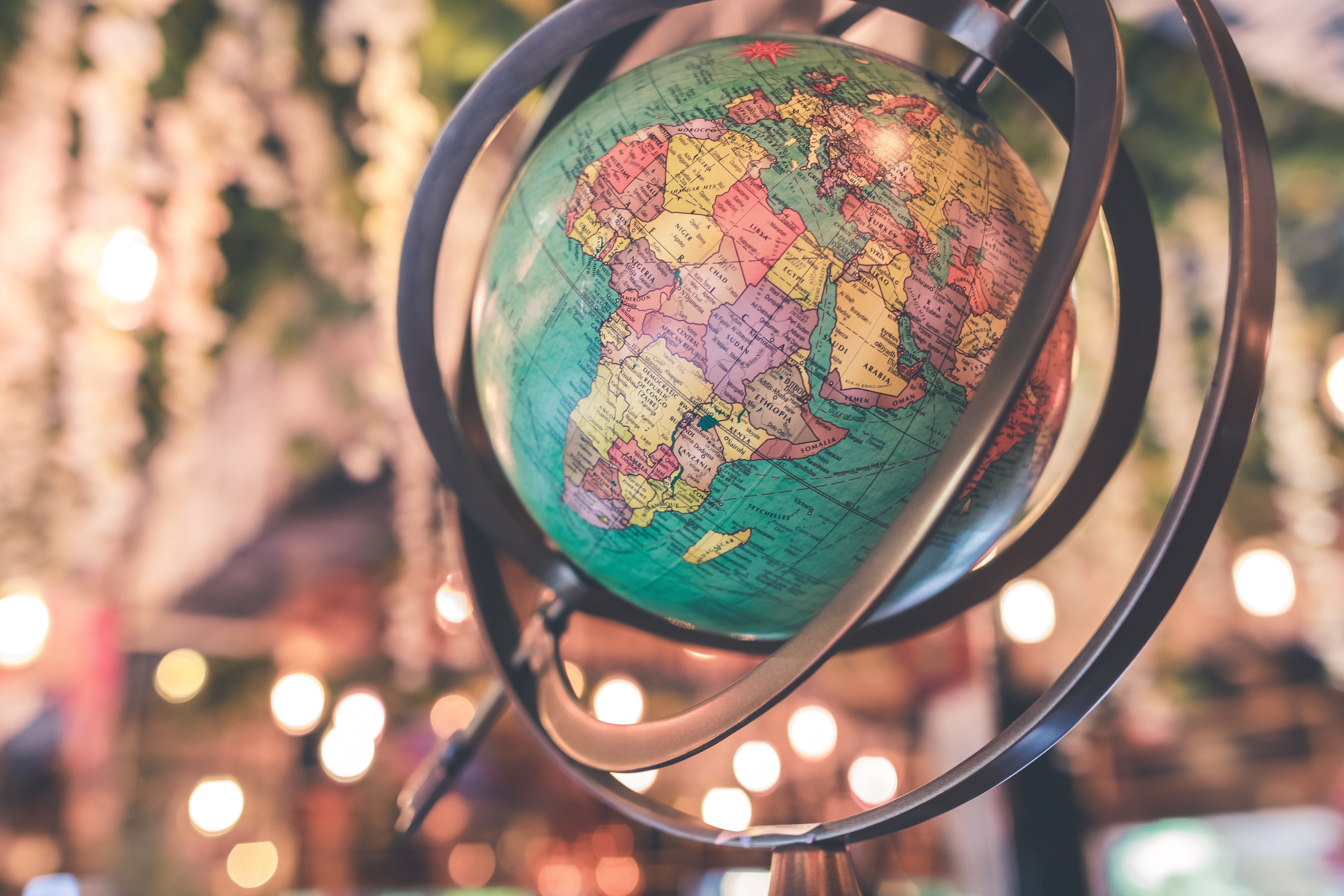 Print out "You Mean The World To Me" on gold foil paper and cover a globe similar  to this one in it. | Photo: Pexels. 