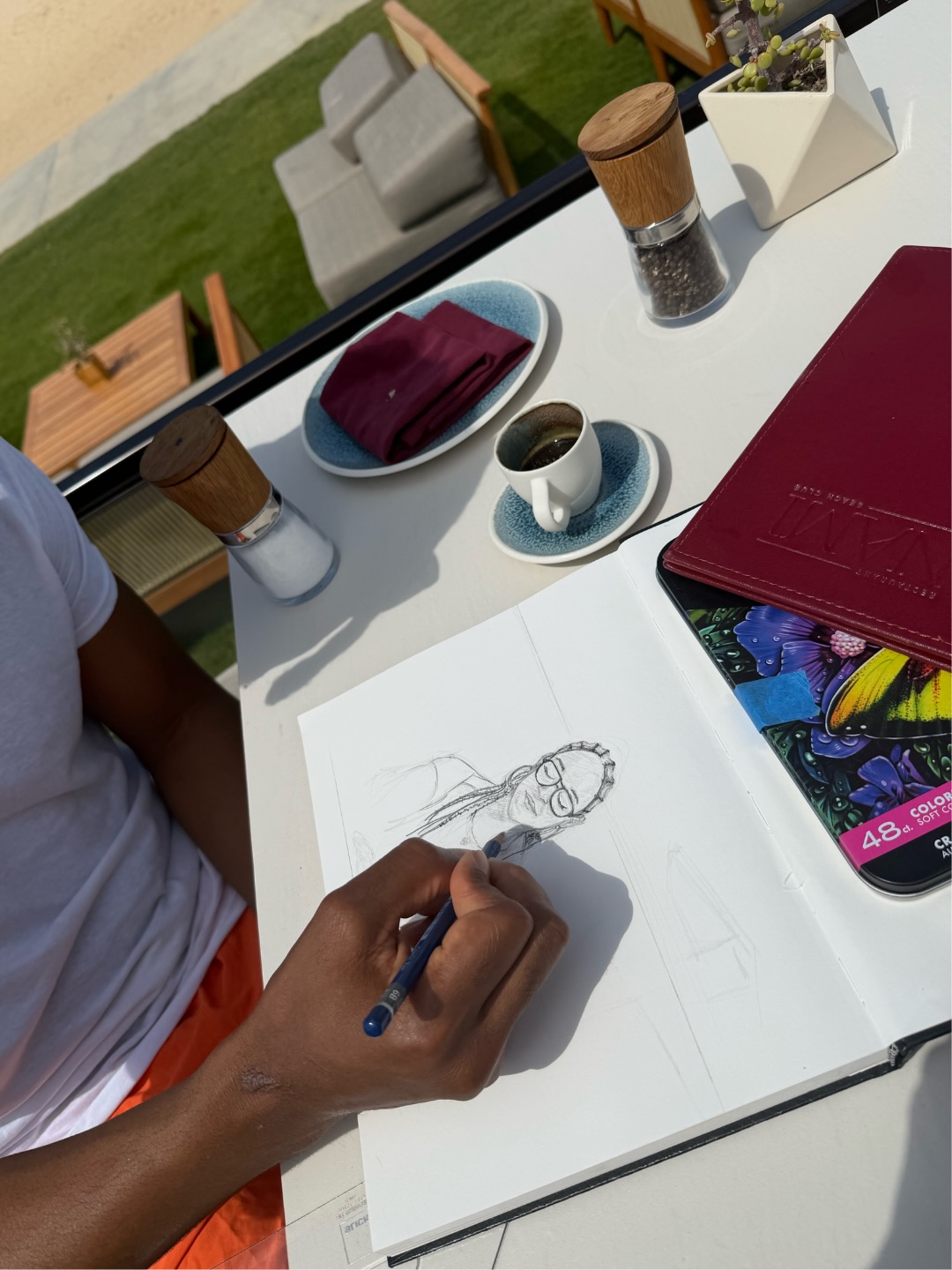 Tia Mowry's partner sketches a portrait of the actress during their Cabo getaway, from a post dated May 28, 2026 | Source: Instagram/tiamowry