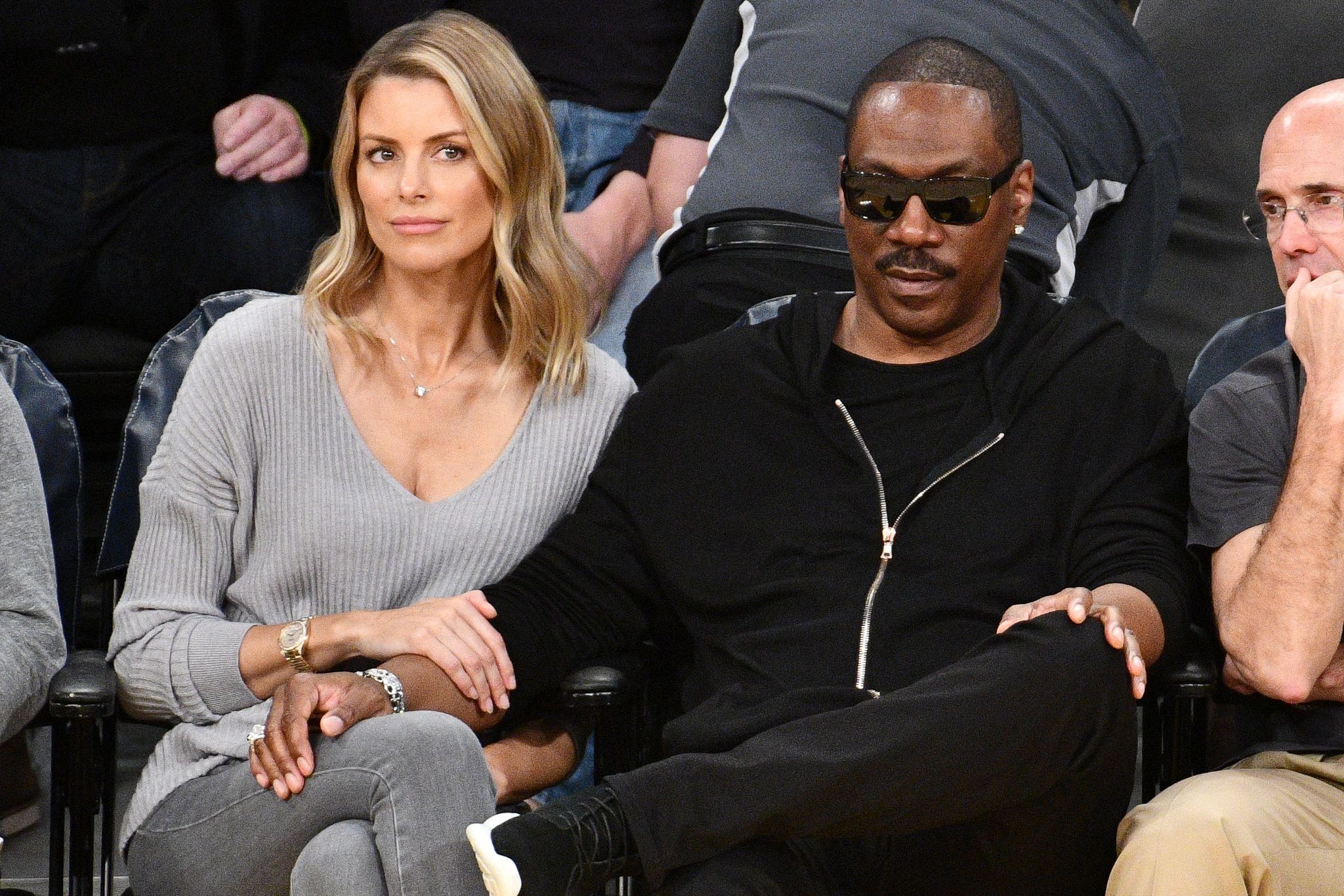 Eddie Murphy and Paige Butcher at a basketball game between the Lakers and the Utah Jazz in 2018 in Los Angeles | Source: Getty Images