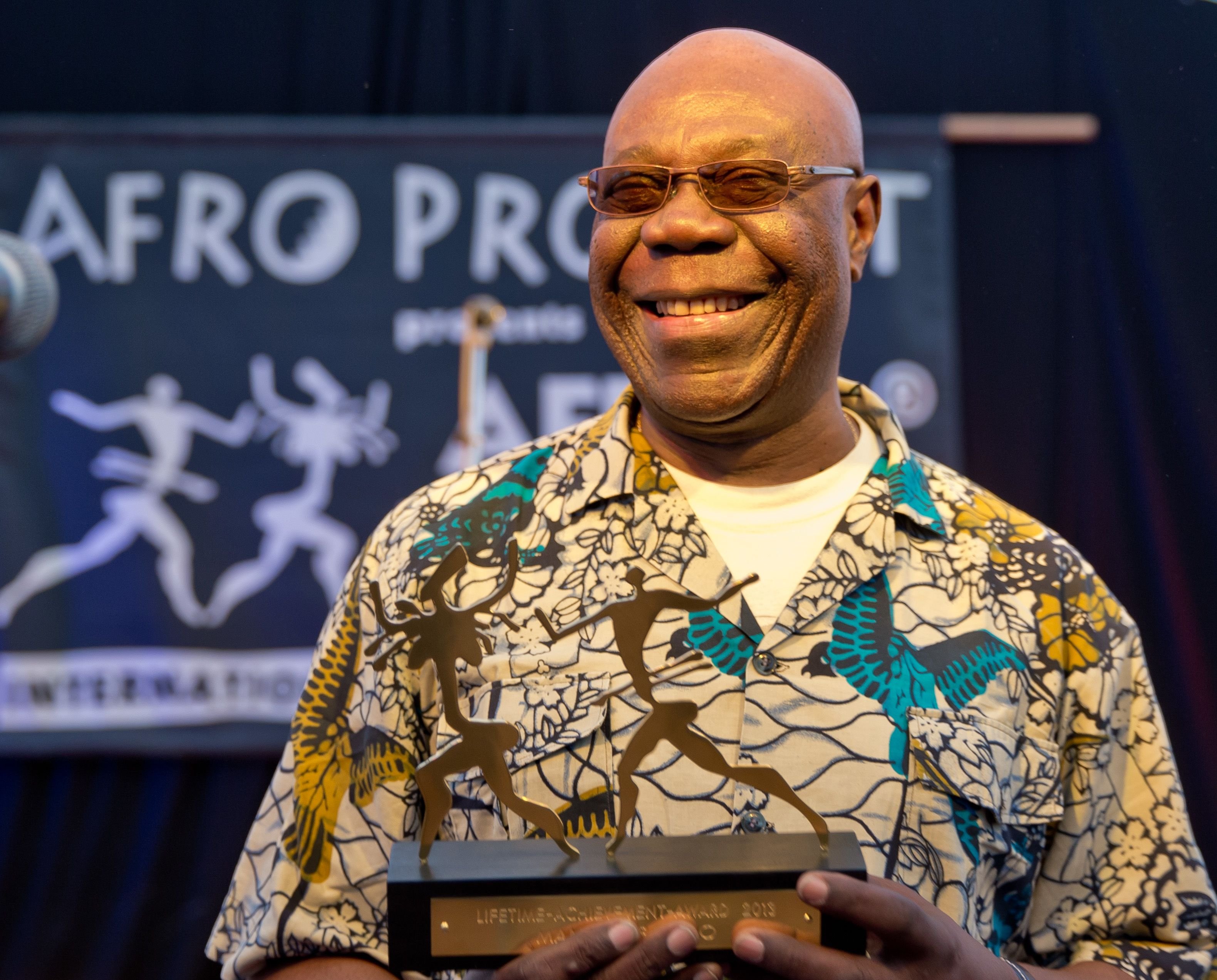 Musician Manu Dibango from Cameroon receives 'Lifetime Achievement Award' during the opening of 25th Africa festival in Wuerzburg, Germany, 30 May 2013. | Source: Getty Images