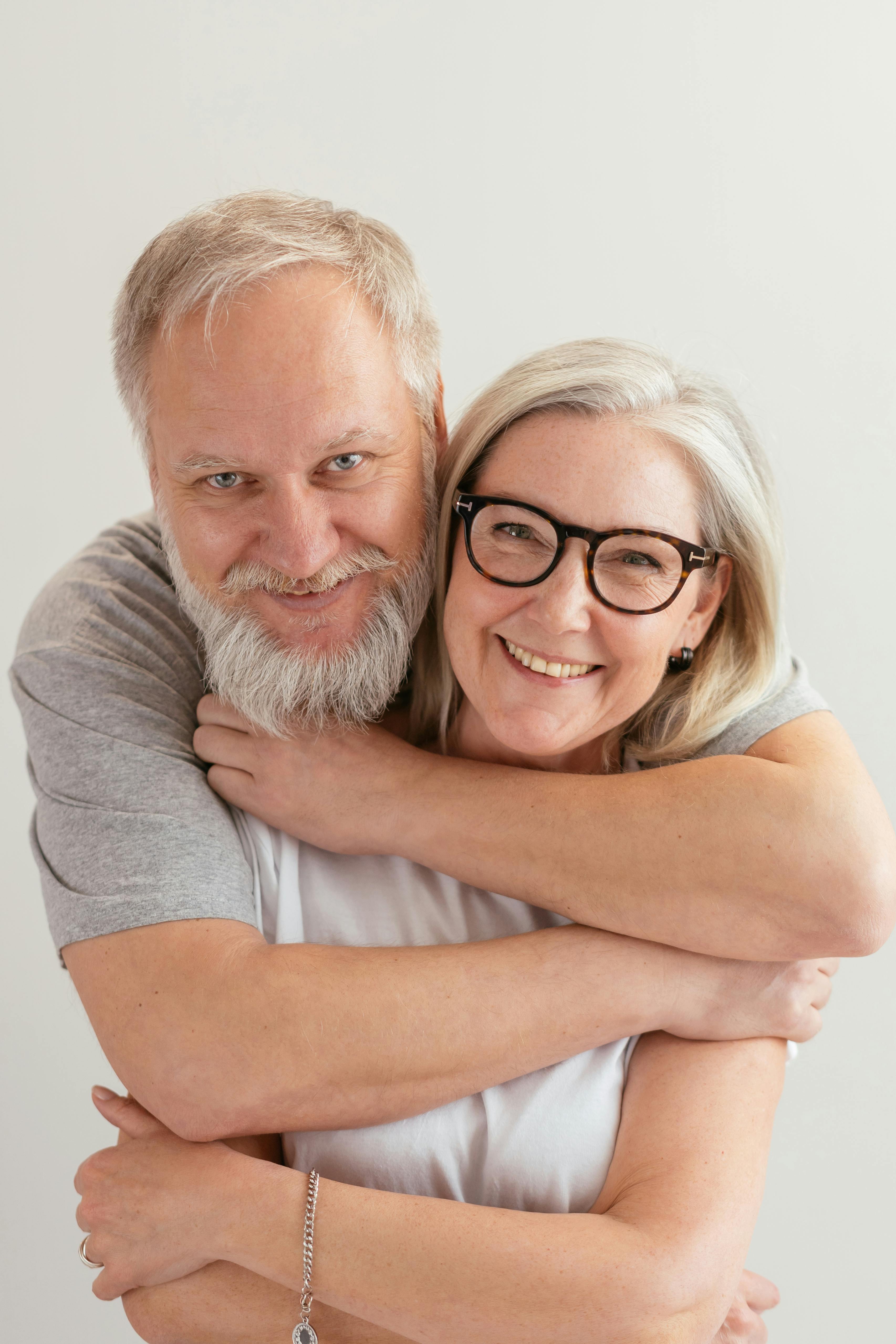 A happy man embracing a woman from behind | Source: Pexels