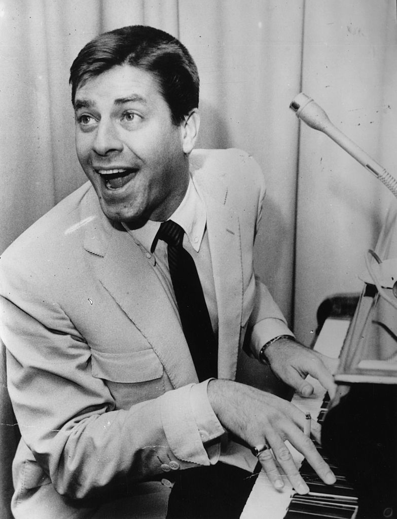 American comedy actor Jerry Lewis, with his mouth open at the piano., circa 1966. | Source: Getty Images