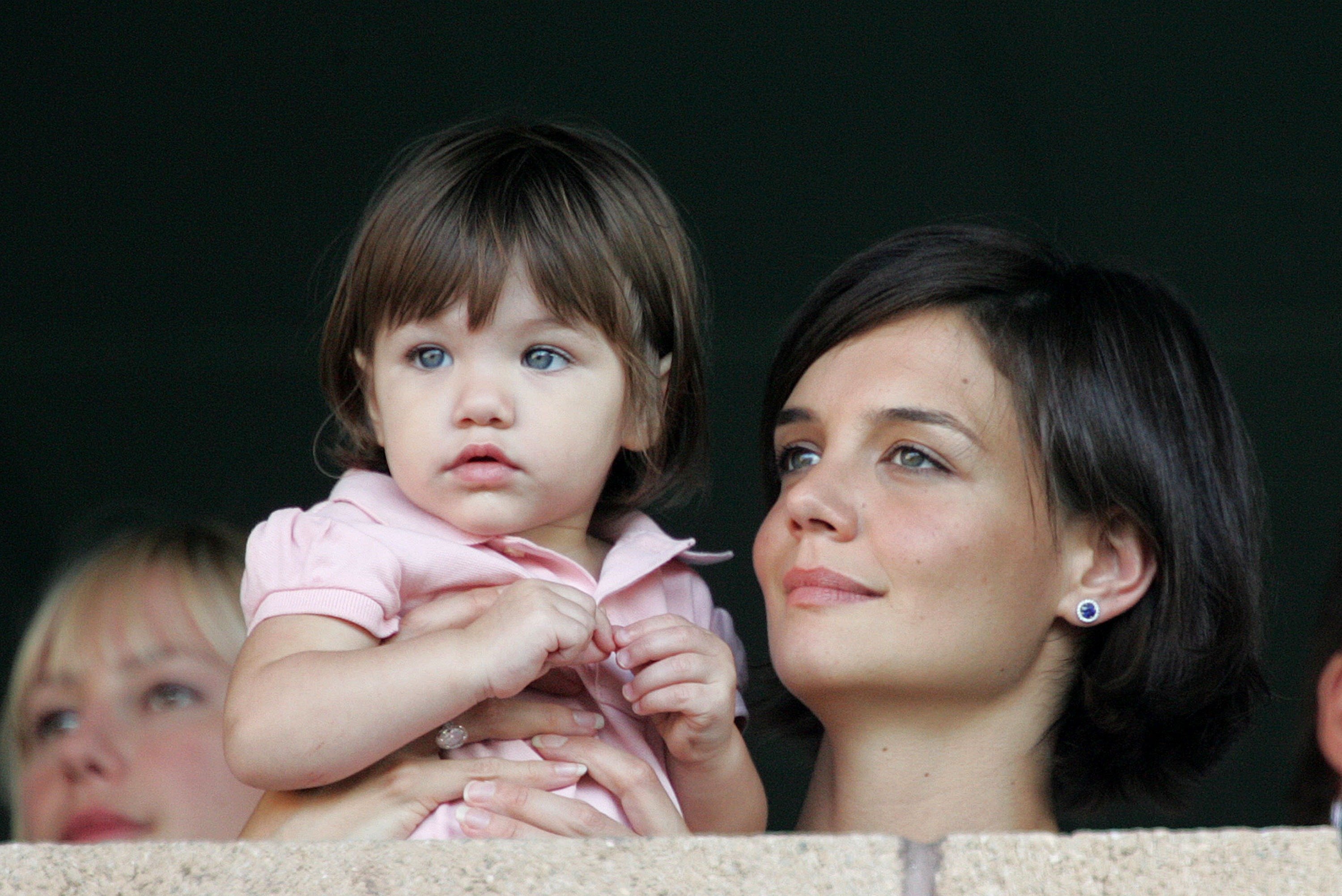 Katie Holmes and daughter Suri watch the LA Galaxy vs. Chelsea FC soccer game July 22, 2007, at the Home Depot Center in Carson, California. | Source: Getty Images.