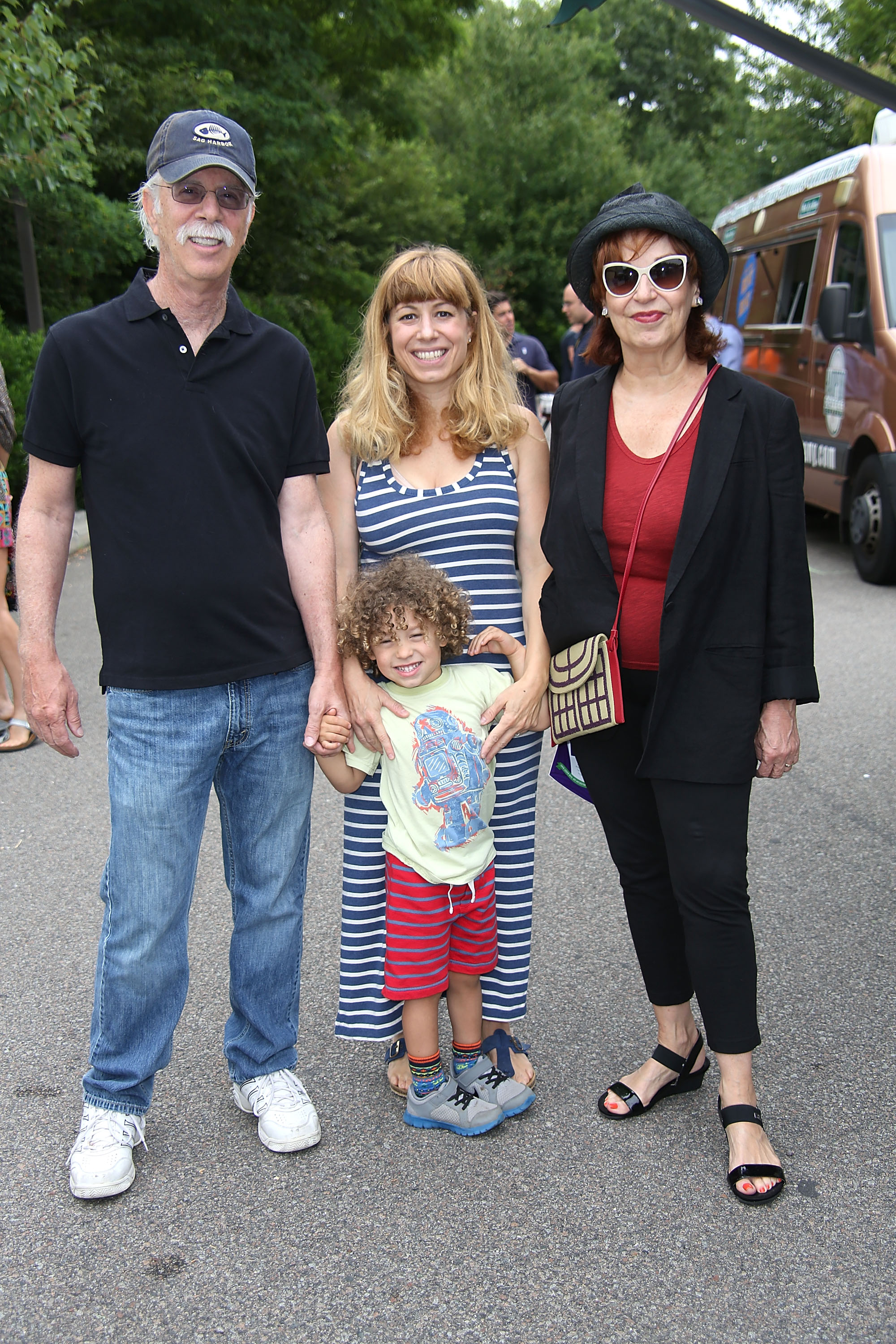 Steve Janowitz, Eve Behar, Luca Scotti, and Joy Behar on July 19, 2014, in Bridgehampton, New York | Source: Getty Images