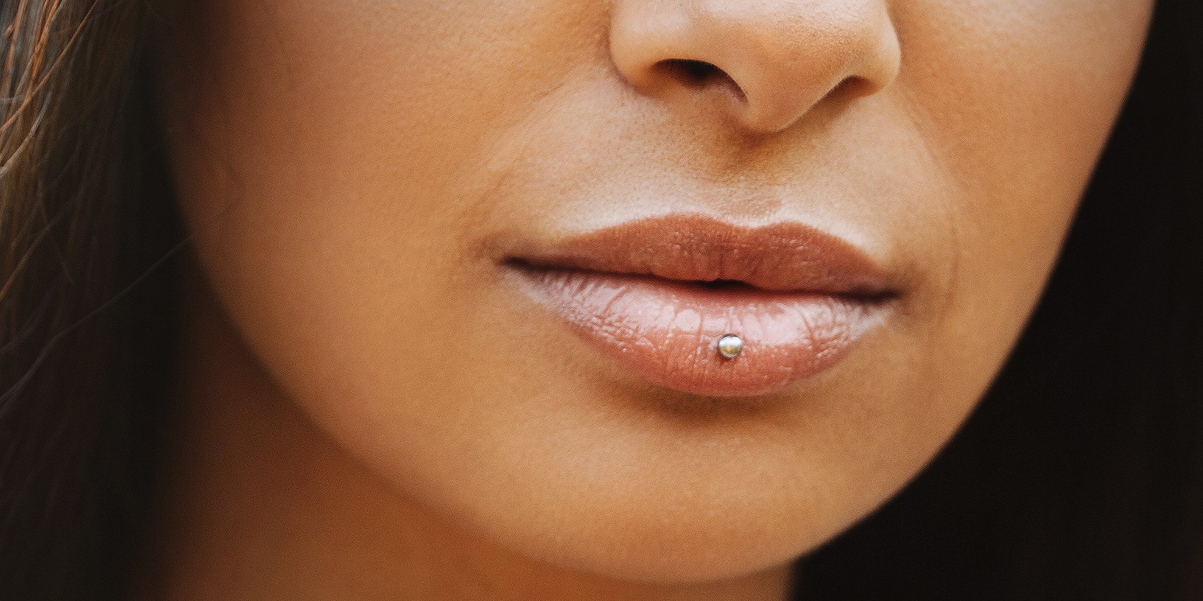 A Close-up Photo of a Woman with an Ashley Piercing | Source: Shutterstock