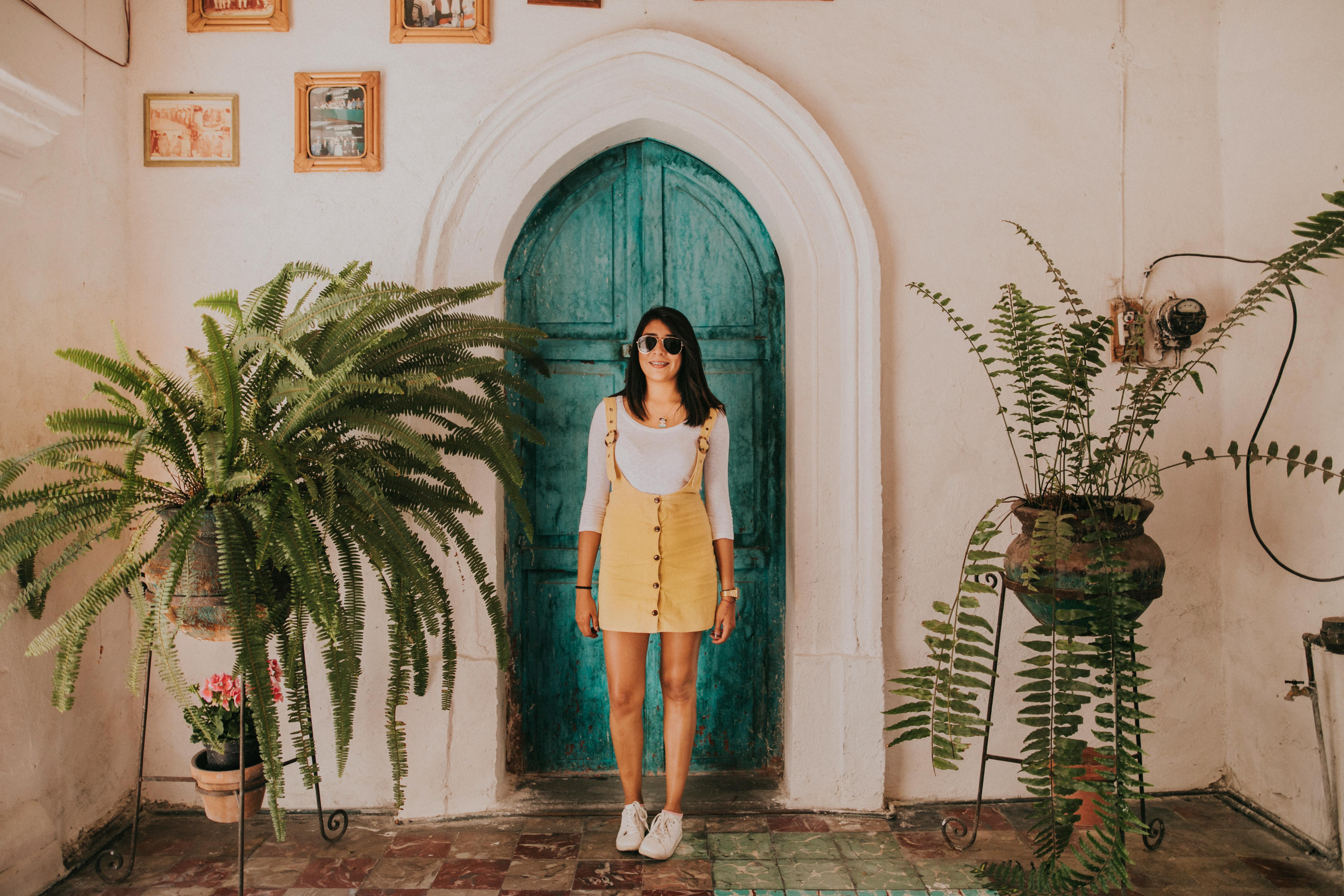 A woman standing in the doorway of a house | Source: Pexels