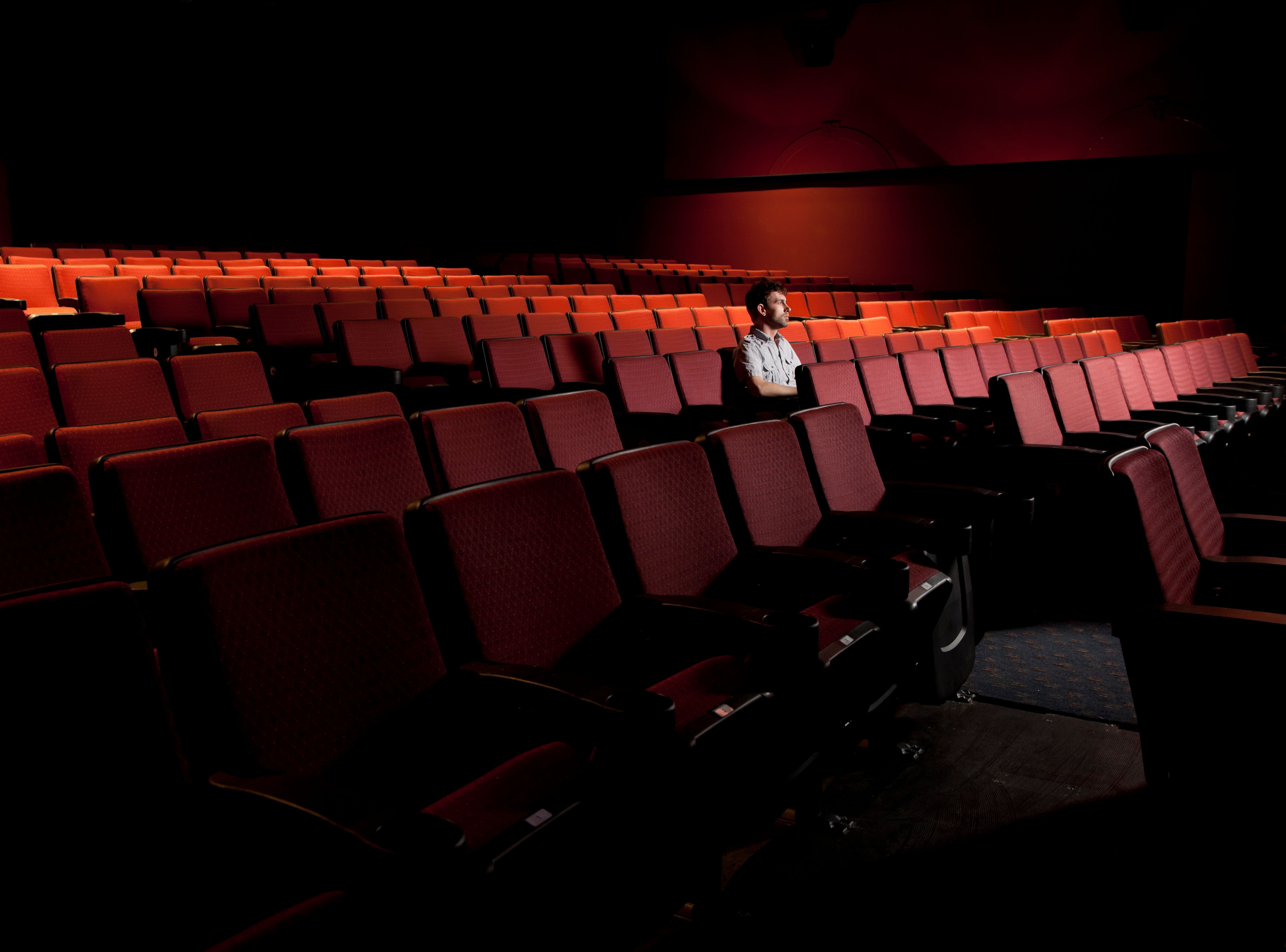 A movie theater with one man. | Source: Getty Images