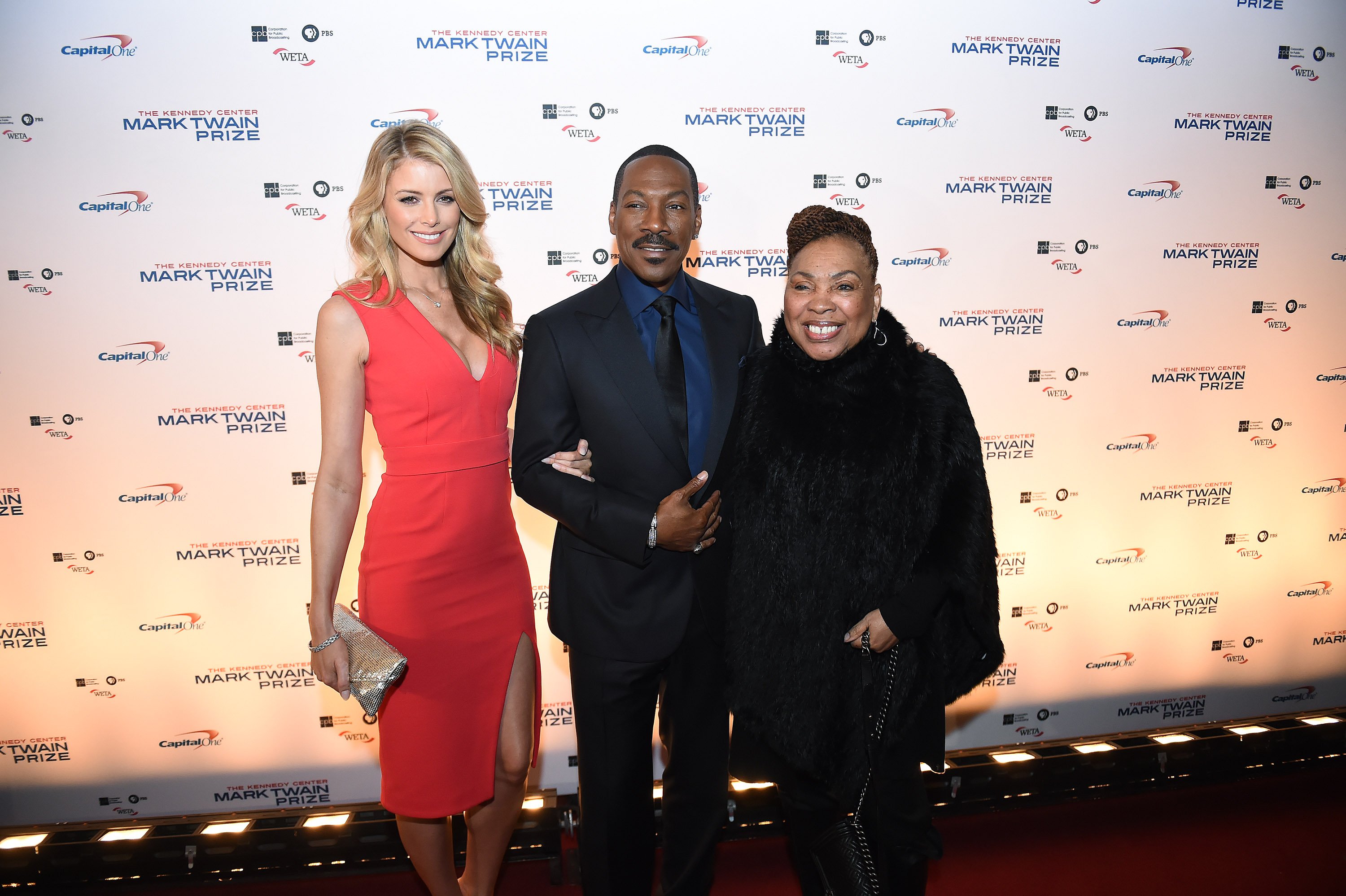 Paige Butcher, left, and Eddie Murphy, center, and Murphy's mother, Lillian Murphy, right are seen on the red carpet at the Kennedy Center for the Mark Twain Prize for American Humor ceremony that honored Murphy on Sunday October 18, 2015 in Washington, DC | Source: Getty Images