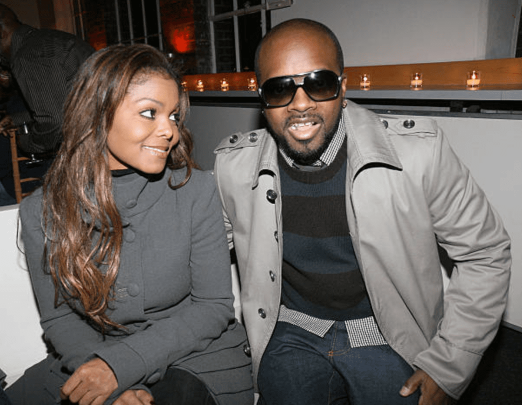 Janet Jackson stares at Jermaine Dupri while seated at a birthday party for Ne-Yo's at Tribeca Rooftop on October 17, 2007, in New York | Source: Getty Images (Photo by Johnny Nunez/WireImage)