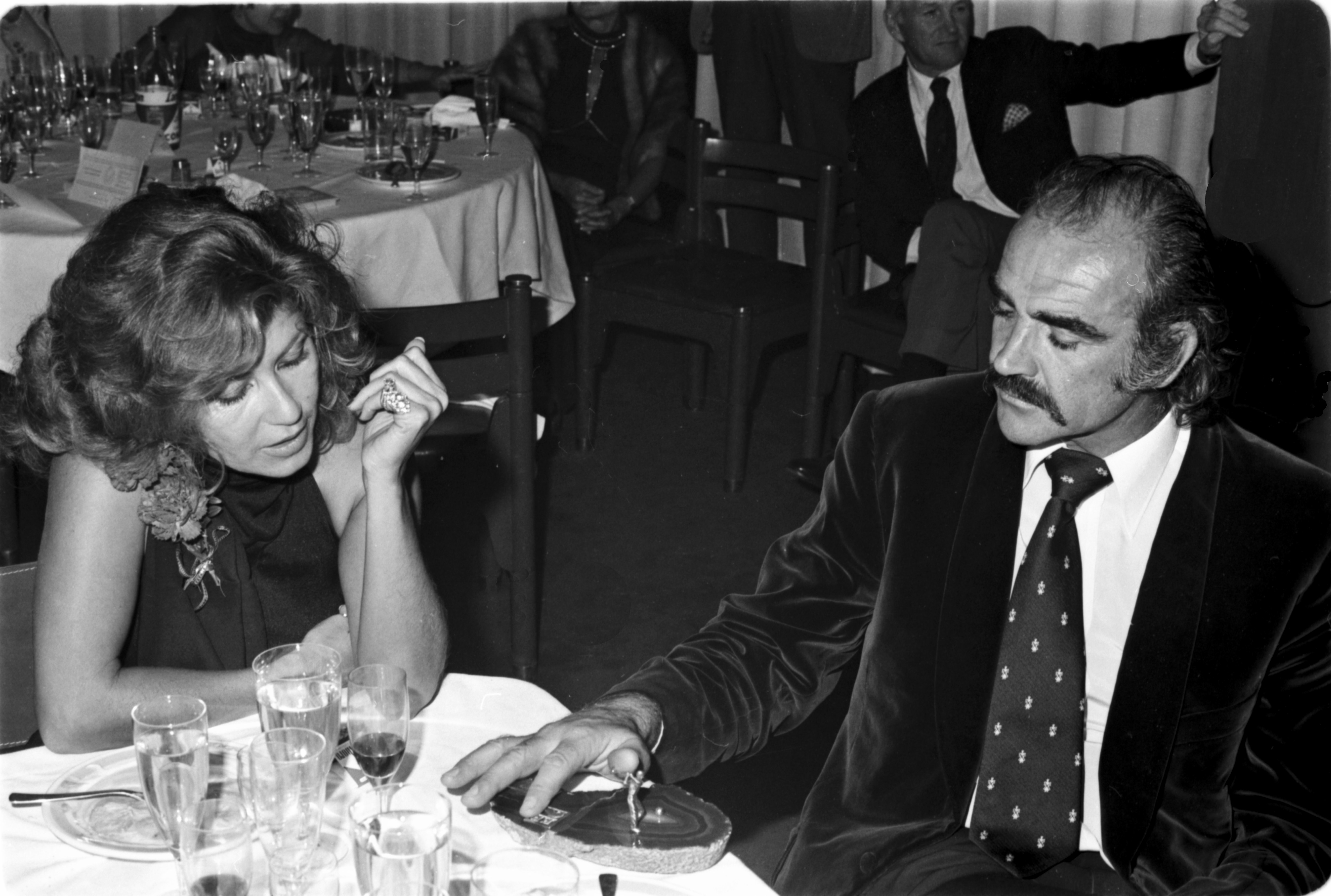 Sean Connery pictured in the restaurant of the golf of "La Manga del Mar Menor" with his wife Micheline Roquebrune in 1973, Murcia, Spain. / Source: Getty Images