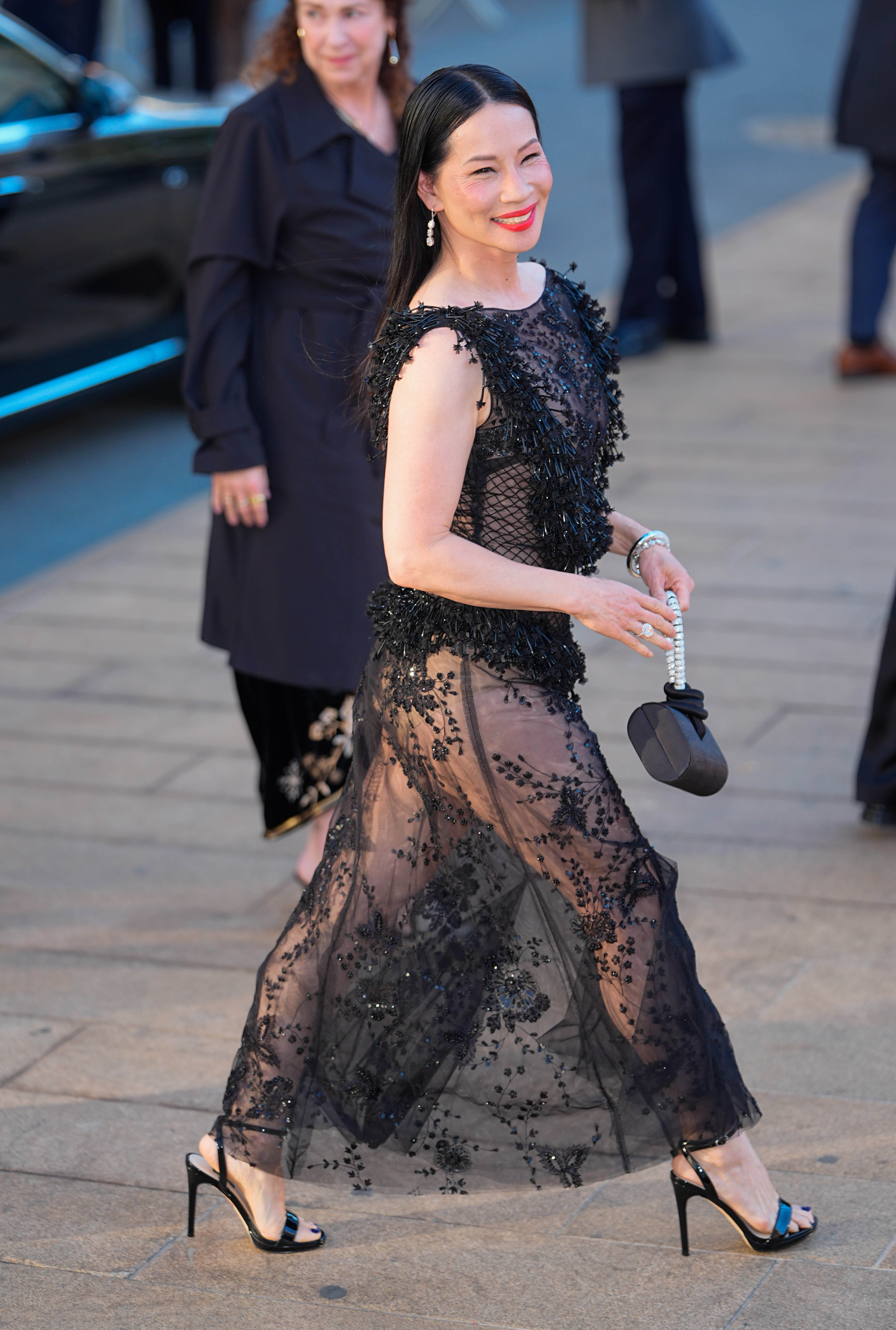 The actress shows off how her sheer her ensemble looks.