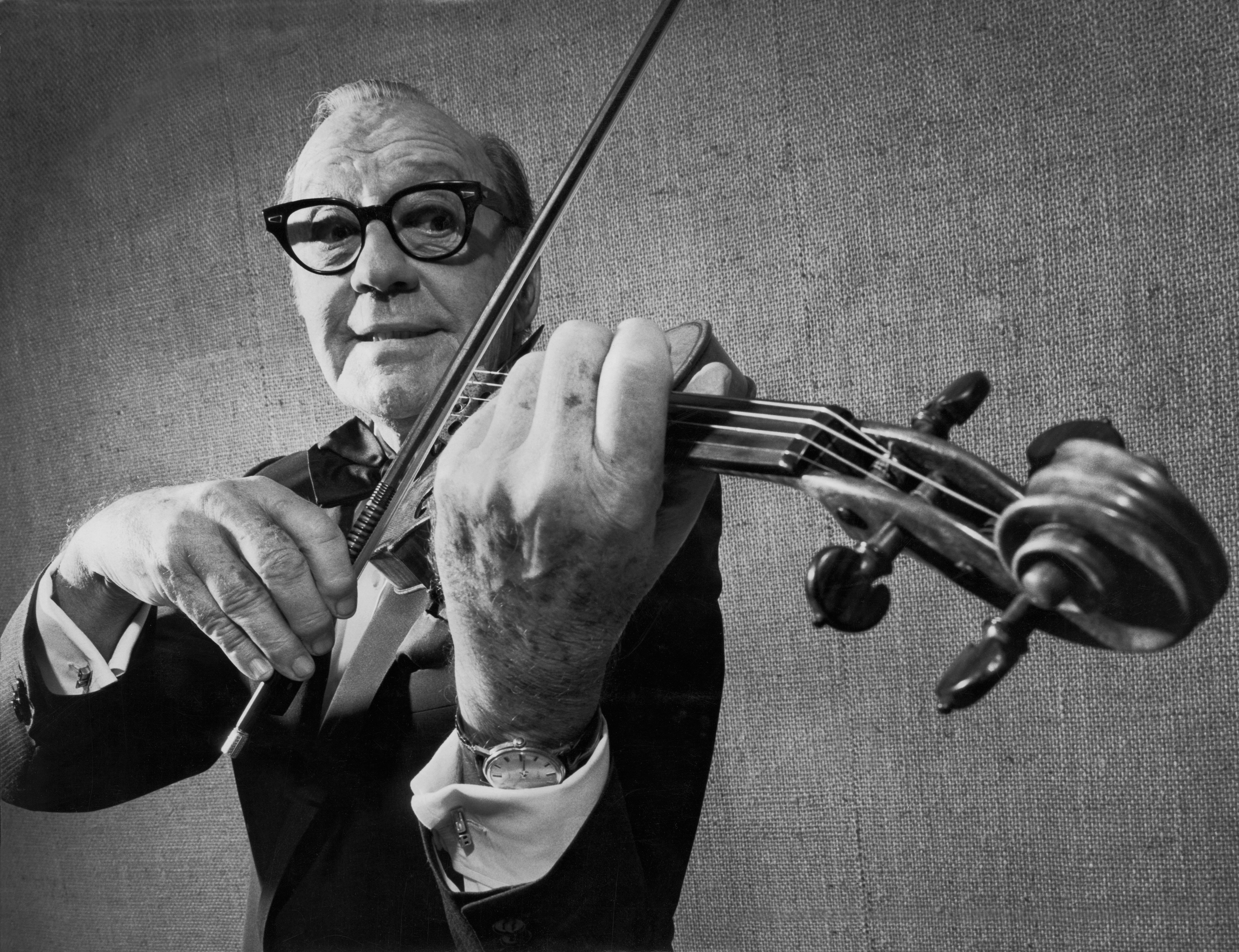 Jack Benny playing the violin in 'Jack Benny's First Farewell' production celebrating his fifty years of entertaining, New York, New York, 1973 | Source: Getty Images