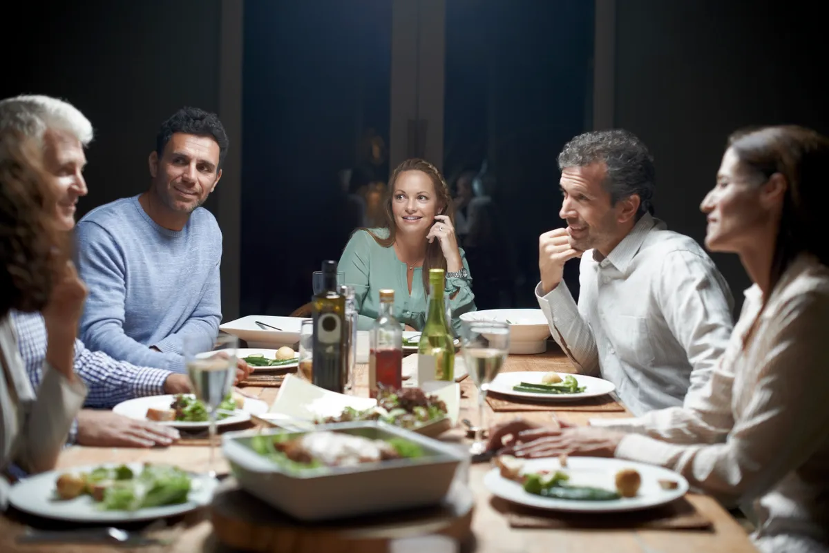 People talking while having dinner | Source: Getty Images