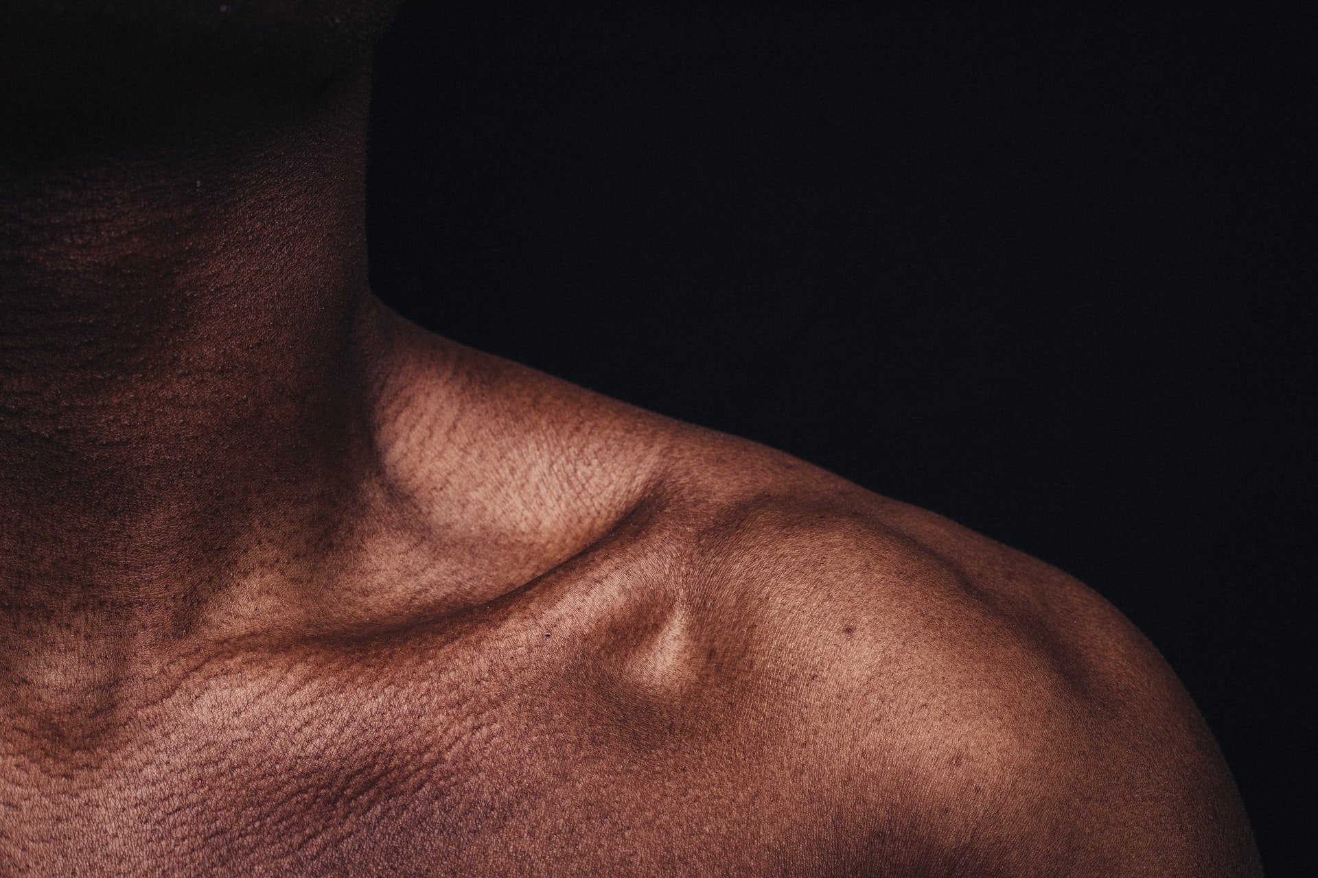 Picture of a male's shoulder. | Source: Unsplash