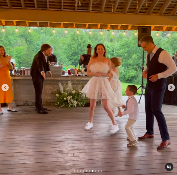 Eva Amurri and Ian Hock dancing with Marlowe, Major and Mateo Martino at their wedding, posted on July 2, 2024 | Source: Instagram/writerdirector