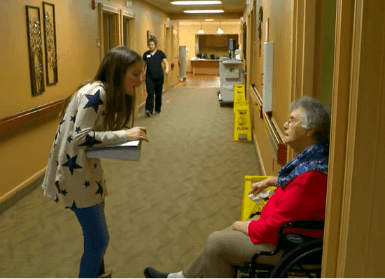Ruby Chitsey asking a nursing home resident about her wishes | Photo: CBS News