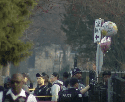 Two balloons floating outside the residence where the baby shower was taking place | Photo: CBS Chicago