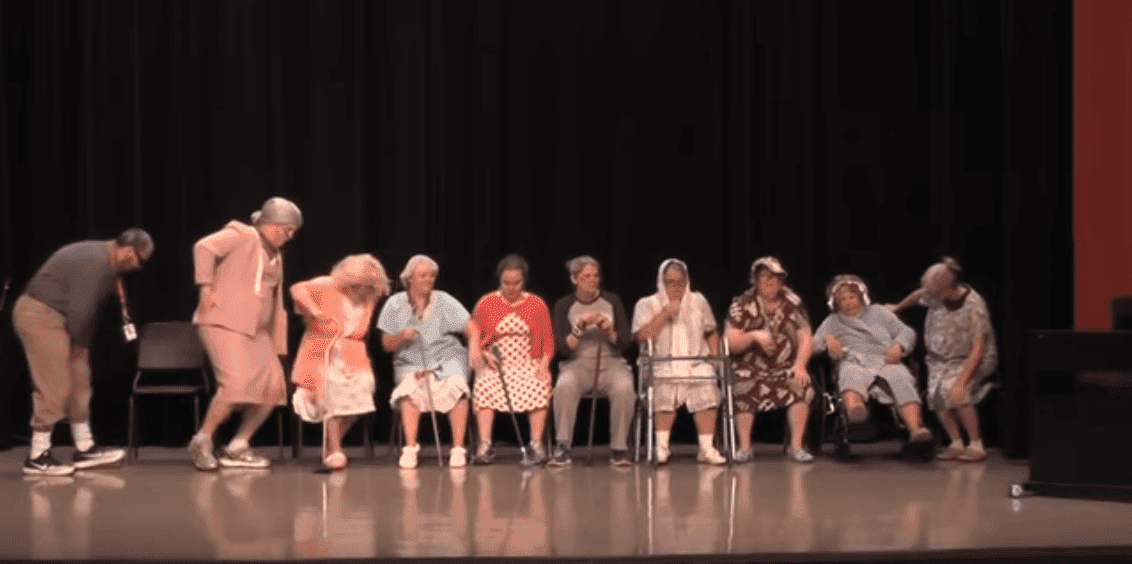 A line of grandmas and one grandpa entering the stage. | Photo: YouTube/Scott Reece