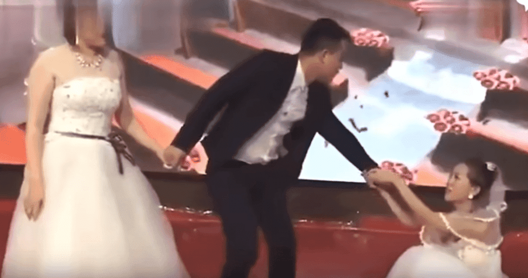 Ex-girlfriend dragging the groom towards her | Photo: YouTube/The AIO Entertainment