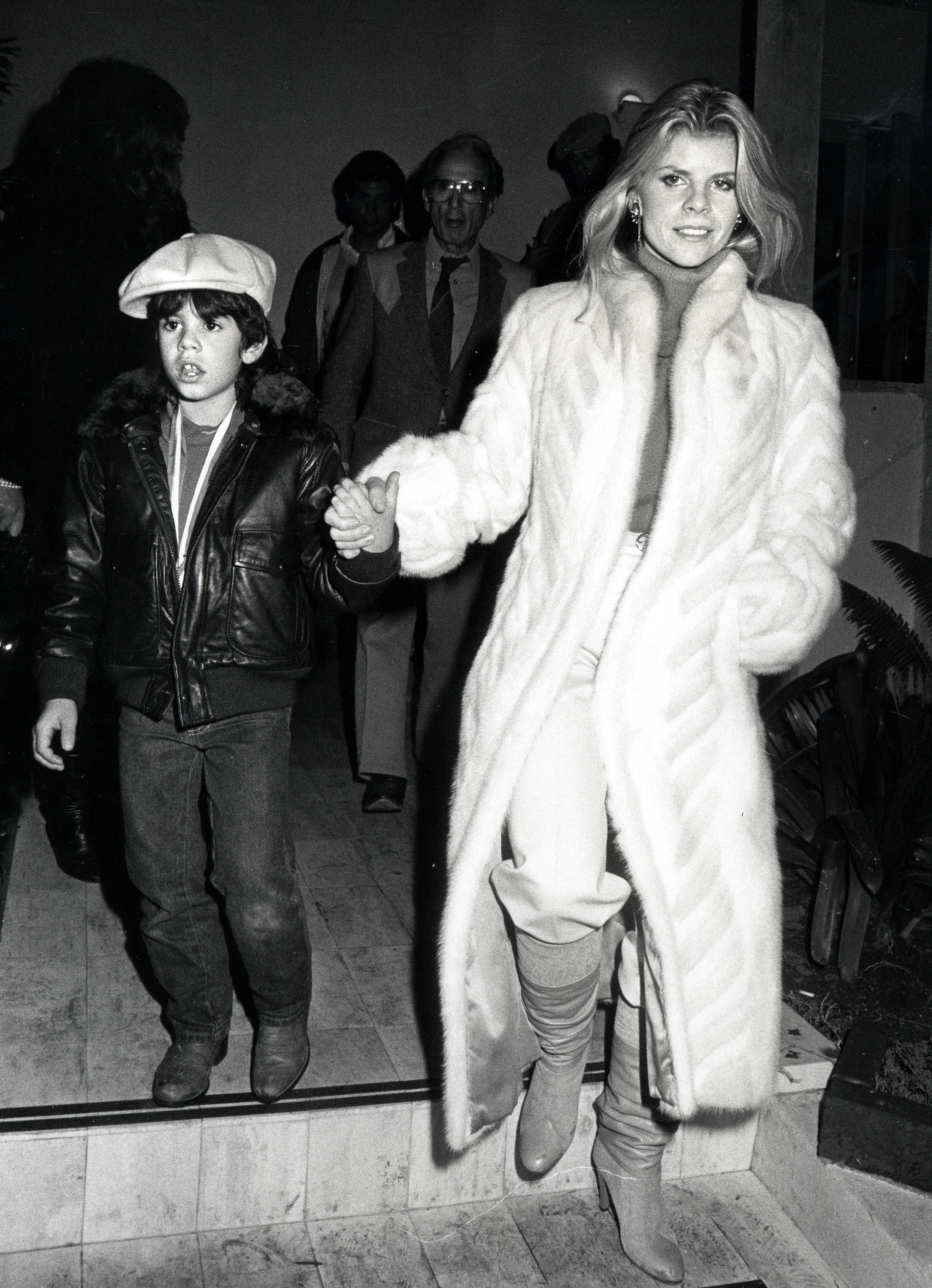 The boy and his mother at Spago's Restaurant in Beverly Hills on December 1, 1983 | Source: Getty Images