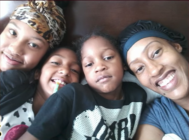 Photo of LaTonya Young and her children from a video dated September 6, 2021 | Source: YouTube/MrMcCruddenMichael