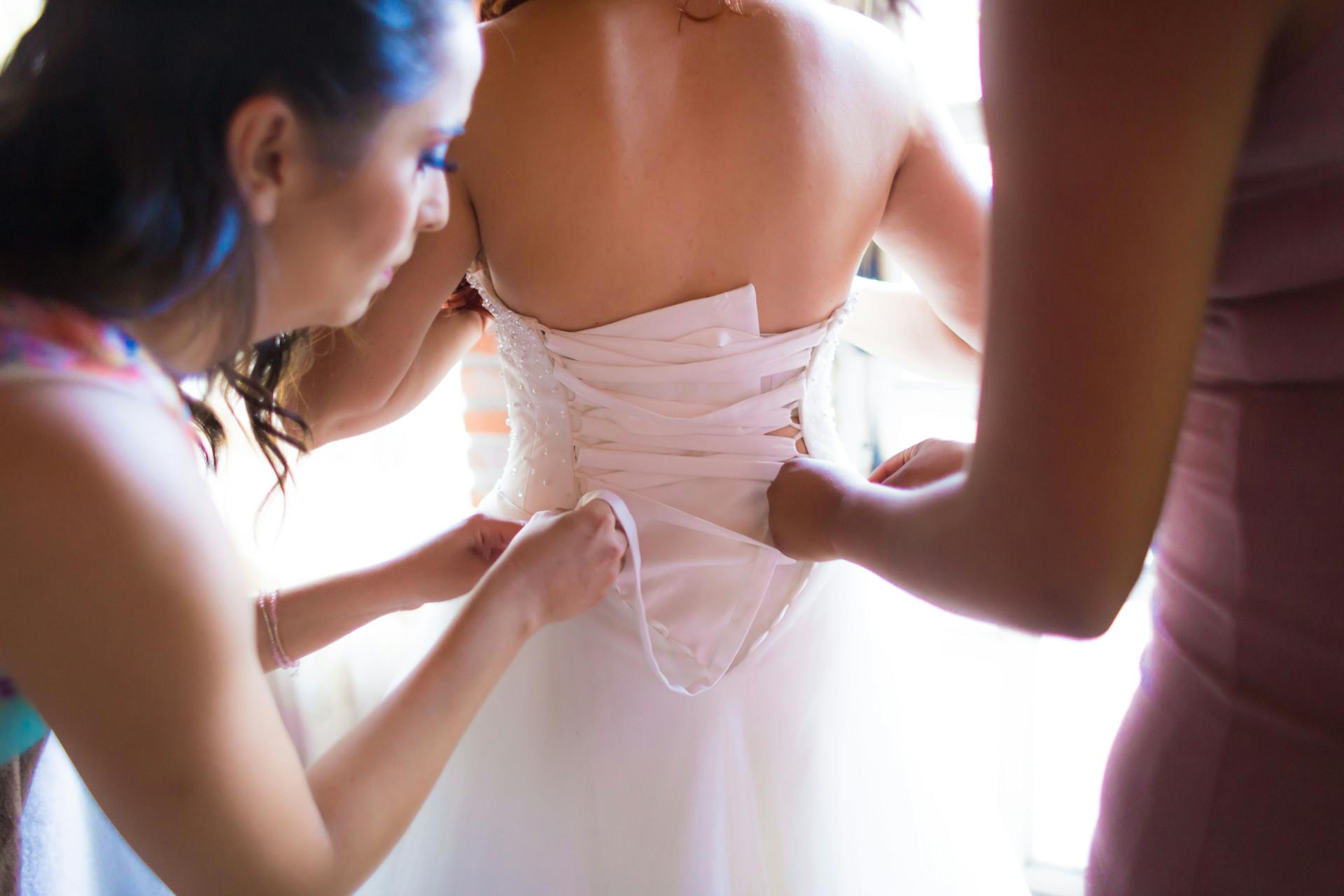 A bride getting dressed | Source: Pexels