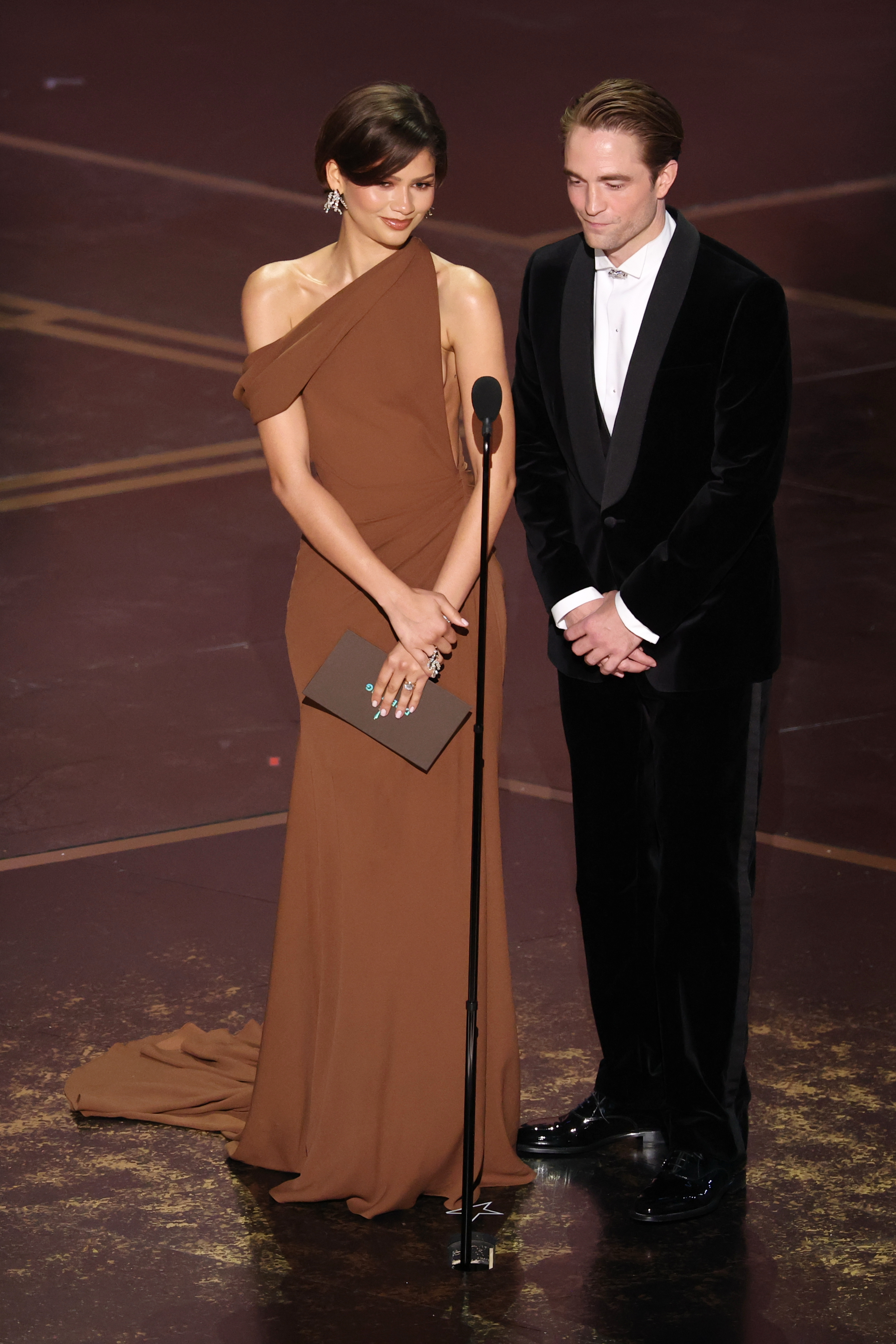 Zendaya and Robert Pattinson onstage. | Source: Getty Images