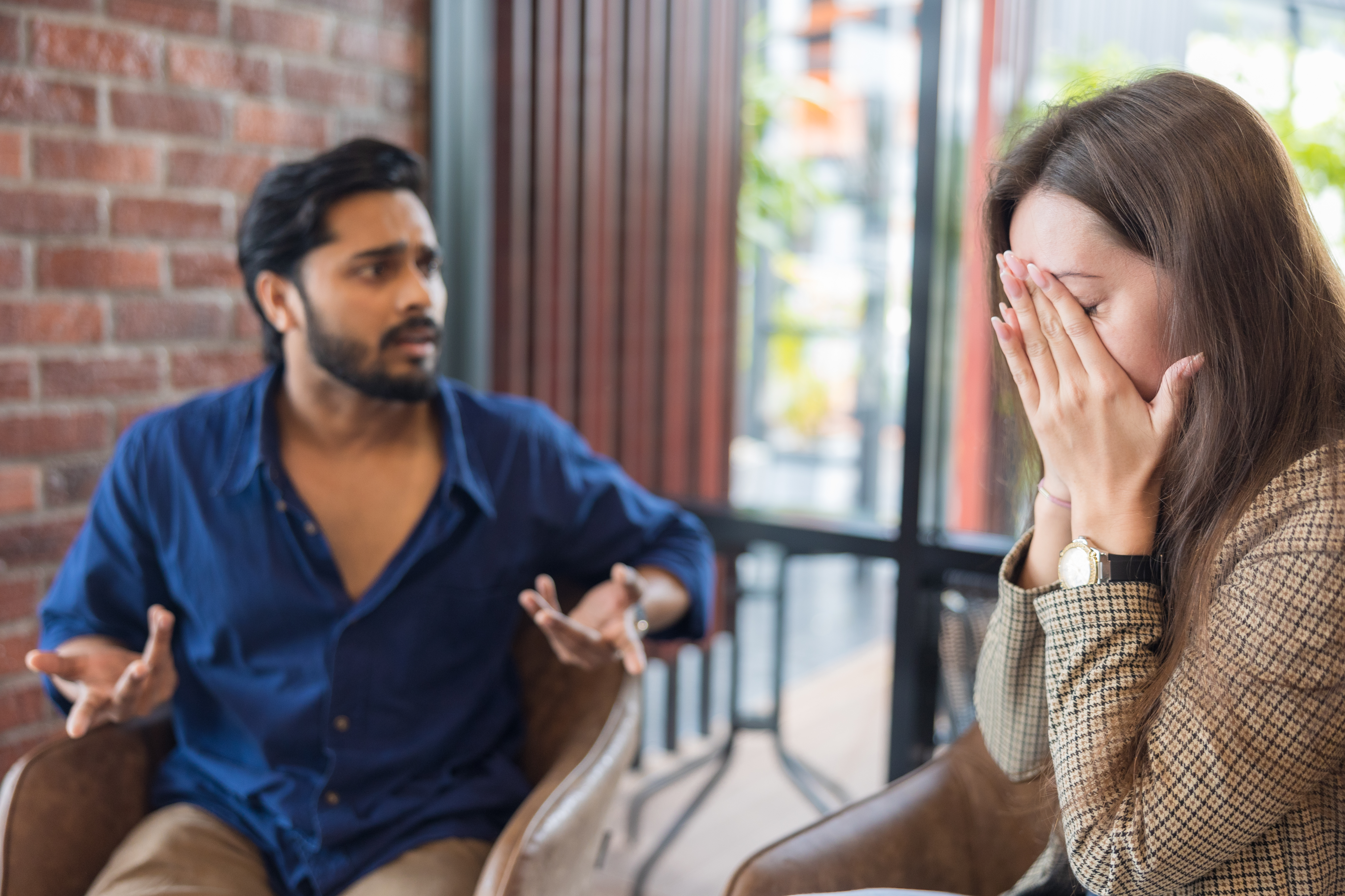 Young couple arguing while having problems in their relationship | Source: Getty Images