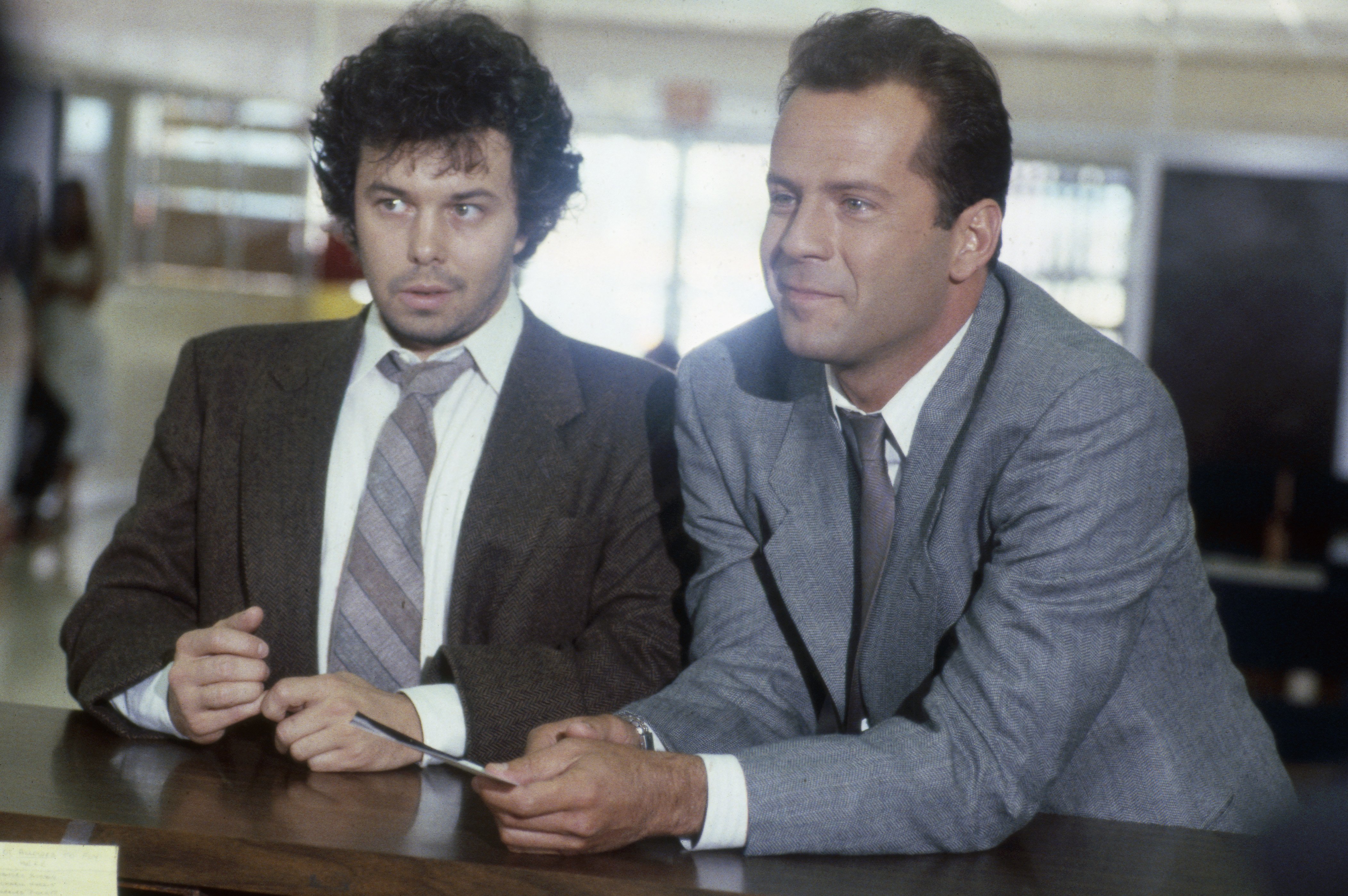 Actor Curtis Armstrong as Herbert Viola and Bruce Willis as David Addison in the hit series "Moonlighting," on August 19, 1987. / Source: Getty Images