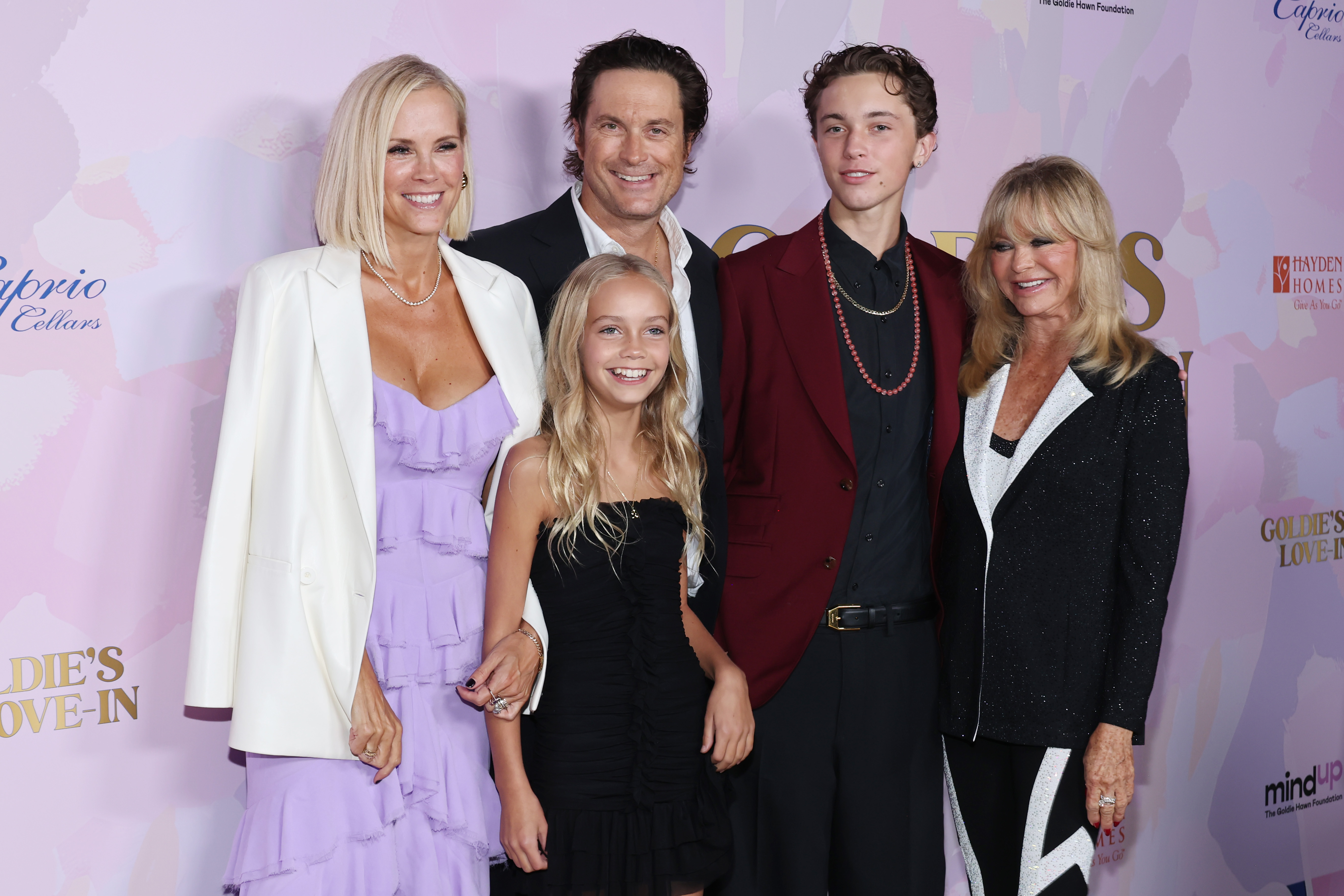 The Hudson family stepped out in full for the 20th anniversary of the Goldie Hawn Foundation and MindUP Gala. Goldie Hawn was joined by son Oliver, daughter-in-law Erinn, and grandchildren Rio and Wilder, all posing together at the Beverly Hills event on September 27, 2024, in a show of family unity and support.