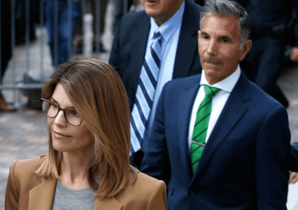 After appearing in court for their role in the college admissions scandal, Lori Loughlin and her husband, Mossimo Giannulli leave with their legal team at the John Joseph Moakley United States Courthouse, on April 3, 2019, Boston | Source: Jessica Rinaldi/The Boston Globe via Getty Images