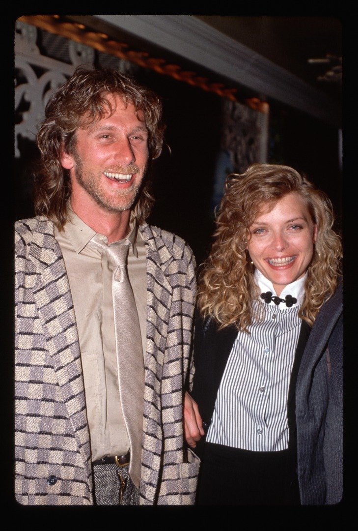 Michelle Pfeiffer and her ex-husband Peter Horton smiling for the cameras at an event. | Source: Getty Images