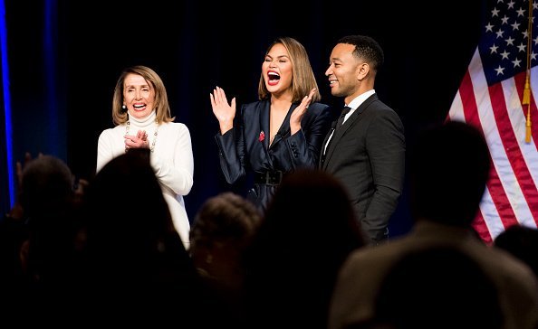 Speaker of the House Nancy Pelosi,  Chrissy Teigen and John Legend on stage | Photo: Getty Images