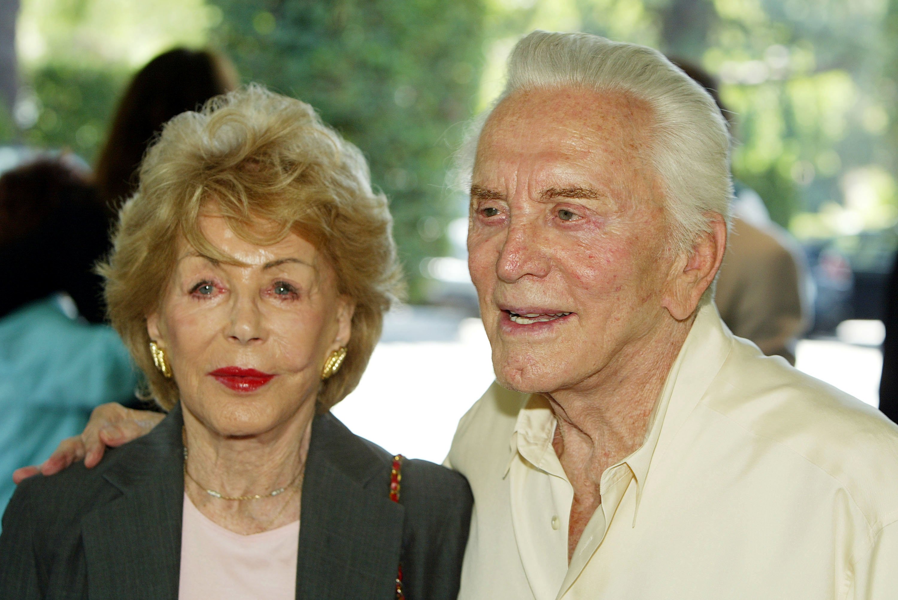 Actor Kirk Douglas (right) and his wife Anne arrive at the annual Hollywood Foreign Press Association installation luncheon on August 11, 2004, at the Beverly Hills Hotel, in Beverly Hills, California. | Source: Getty Images.