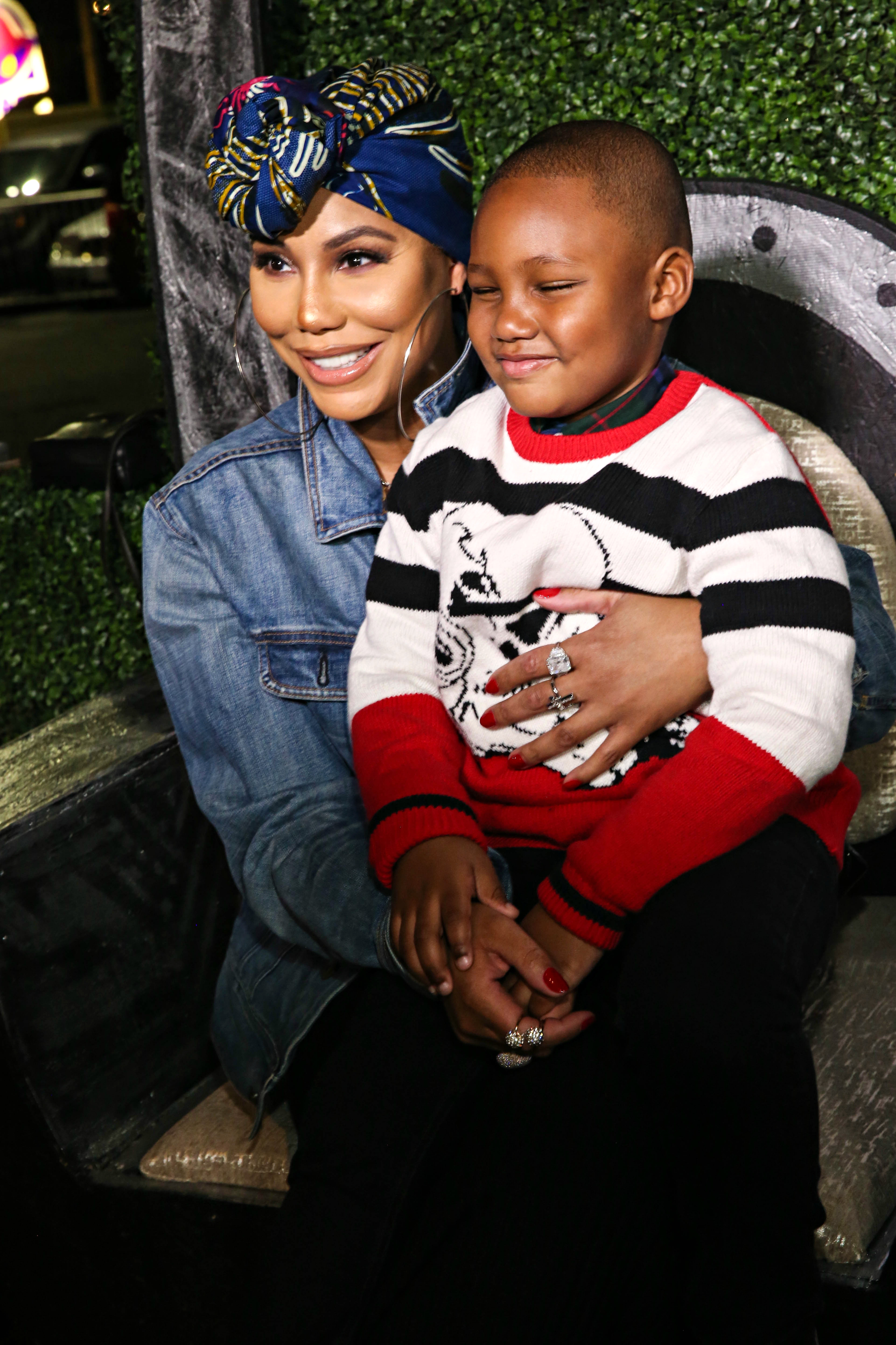Tamar Braxton and her son Logan Vincent Herbert attend the Pan African Film Festival red carpet and screening of Marvel Studios’ "Black Panther" in Los Angeles on February 14, 2018 | Source: Getty Images