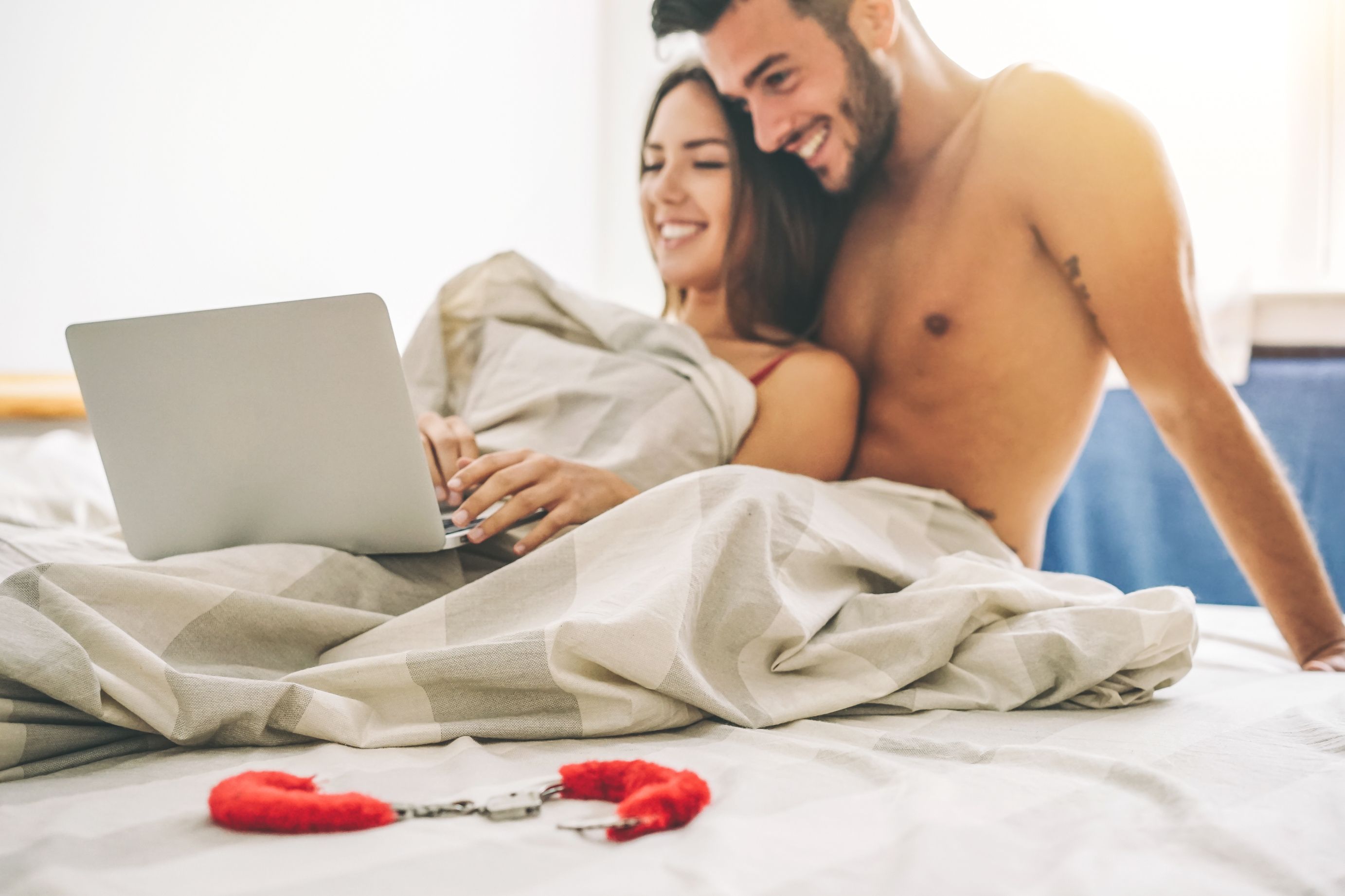 A man in bed with a woman. | Source: Shutterstock