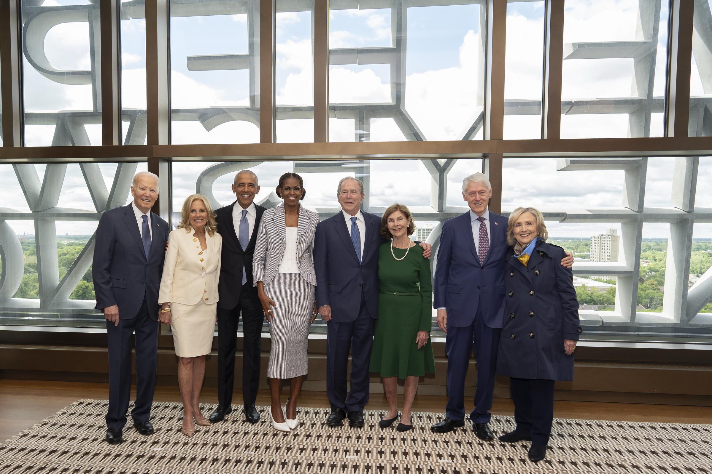 A distinguished group of political leaders gathered to honor a significant architectural milestone on the South Side, though one notable figure was missing from the historic lineup. In this photo, former President Barack Obama and former First Lady Michelle Obama, former President George W. Bush and former First Lady Laura Bush, and former President Bill Clinton and former Secretary of State Hillary Clinton posed ahead of the dedication ceremony for the opening of the Barack Obama Presidential Center at John Lewis Plaza on June 18, 2026, in Chicago, Illinois. | Source: Getty Images