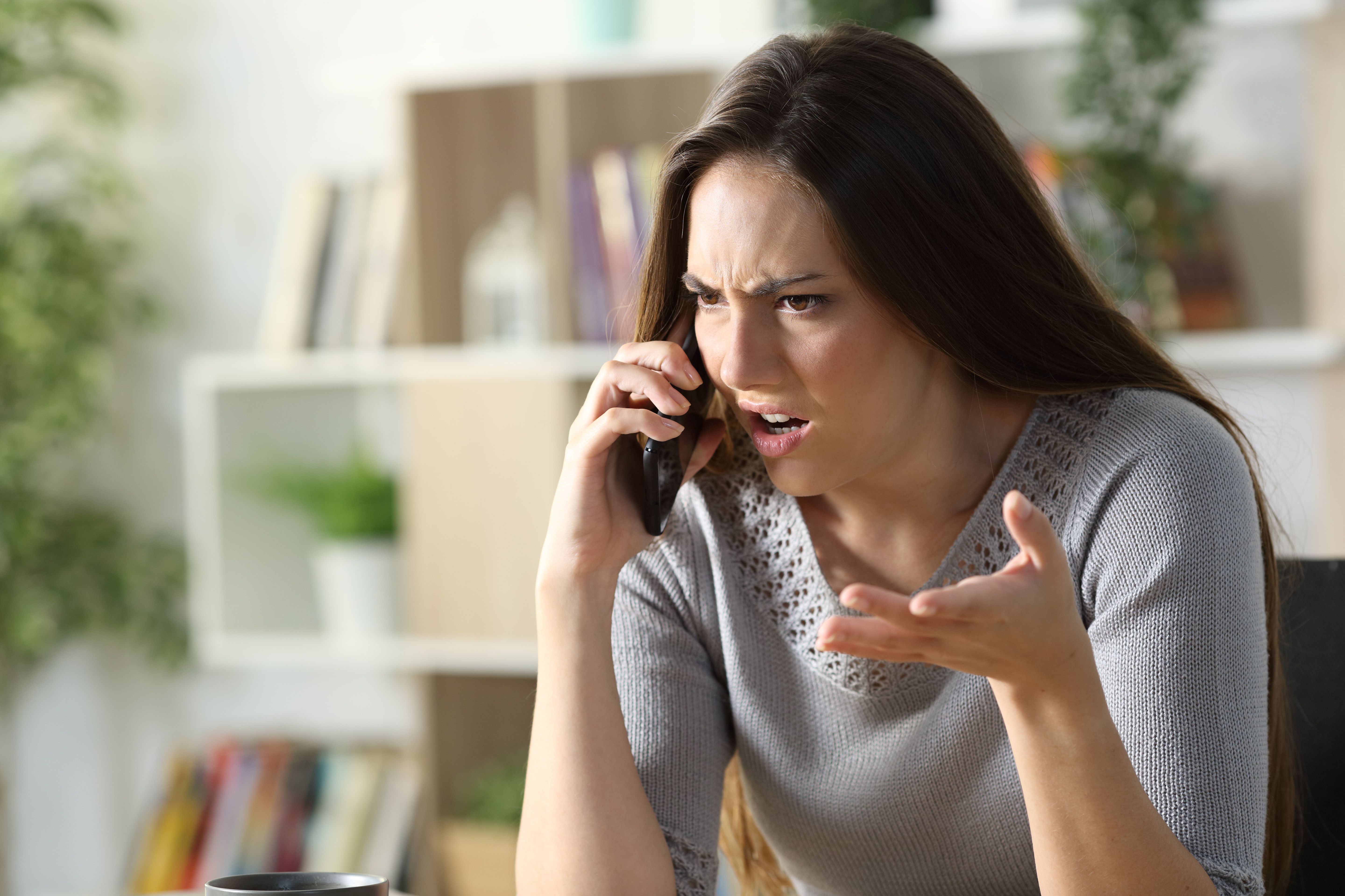 An upset woman on the phone. | Source: Getty Images