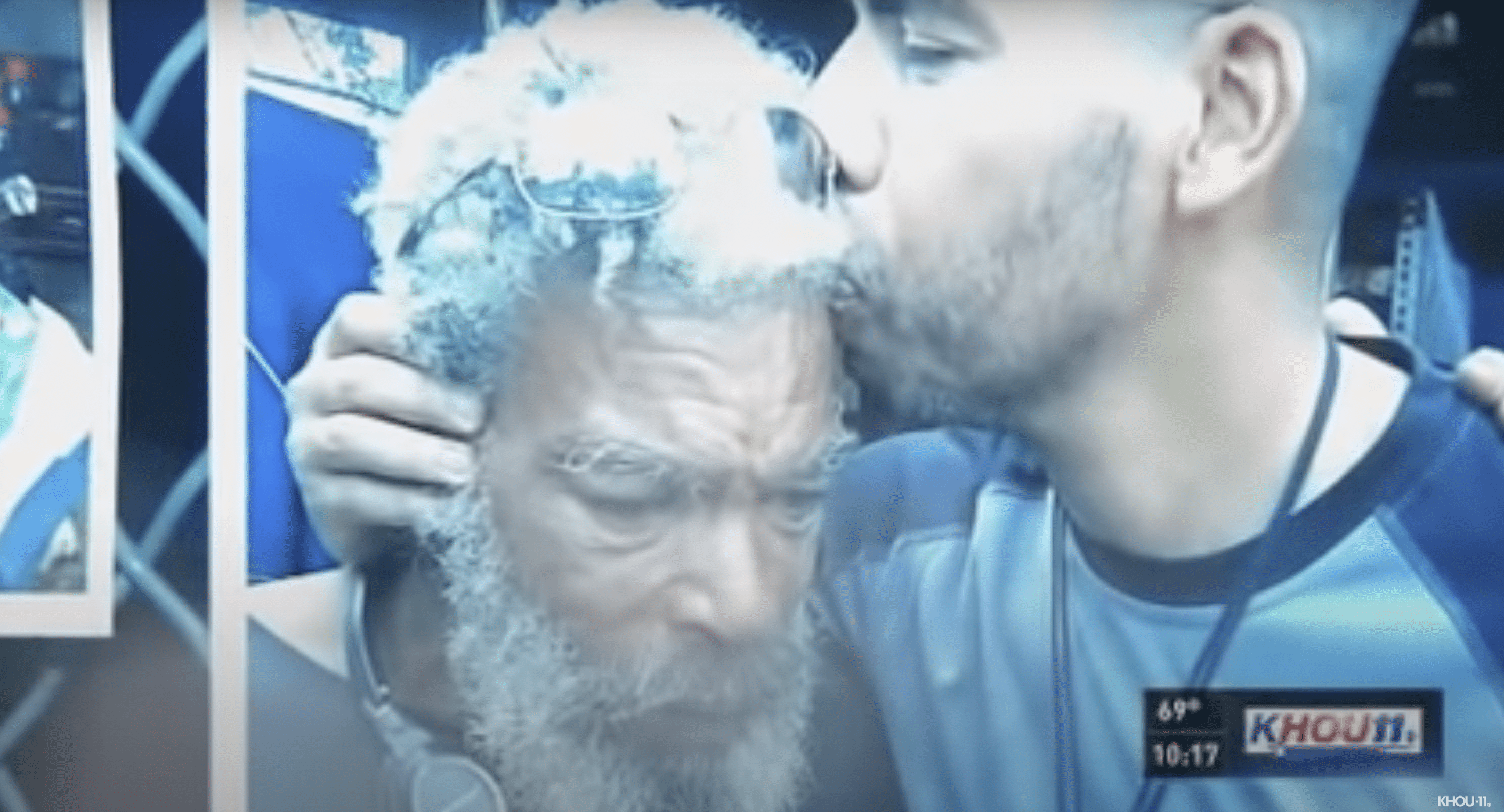 Kevin pictured kissing his father. | Source: youtube.com/KHOU 11