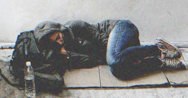 A homeless woman sleeping on the floor | Source: Shutterstock