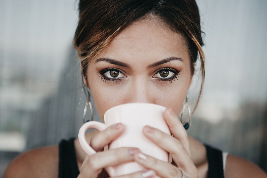 Woman drinking coffee | Source: Unsplash