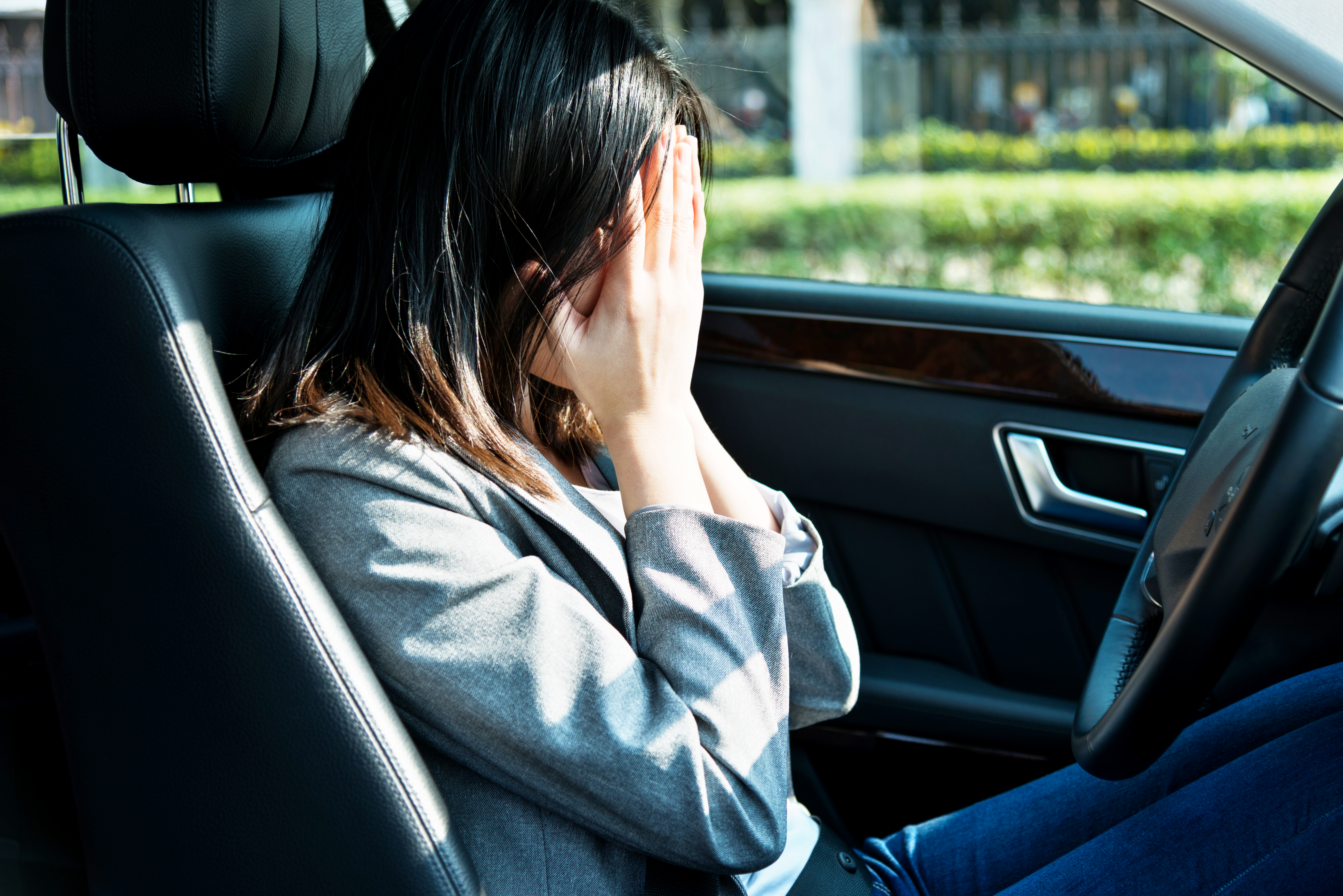 Sad businesswoman driver sitting in car | Source: Getty Images
