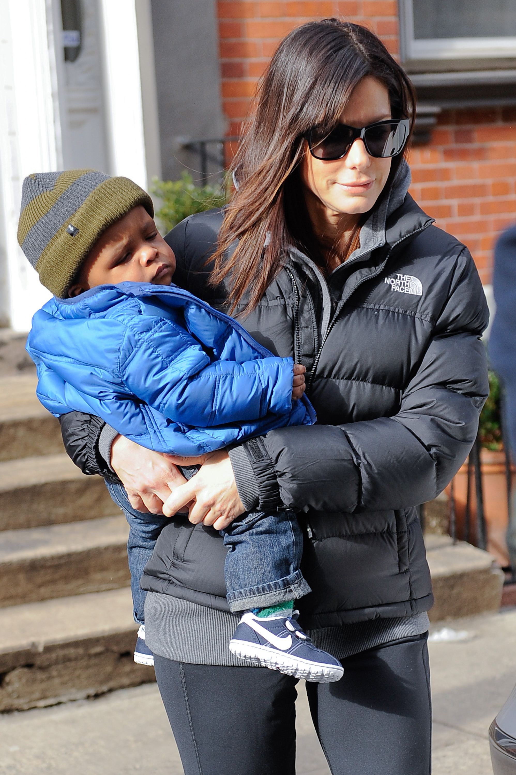 Sandra Bullock and Louis Bullock pictured leaving their Soho home on January 20, 2011 in New York City | Source: Getty Images