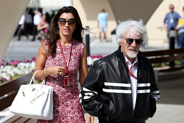 Bernie Ecclestone walks in the Paddock with his wife Fabiana before the Abu Dhabi Formula One Grand Prix at Yas Marina Circuit on November 25, 2018 in Abu Dhabi, United Arab Emirates | Photo: Getty Images