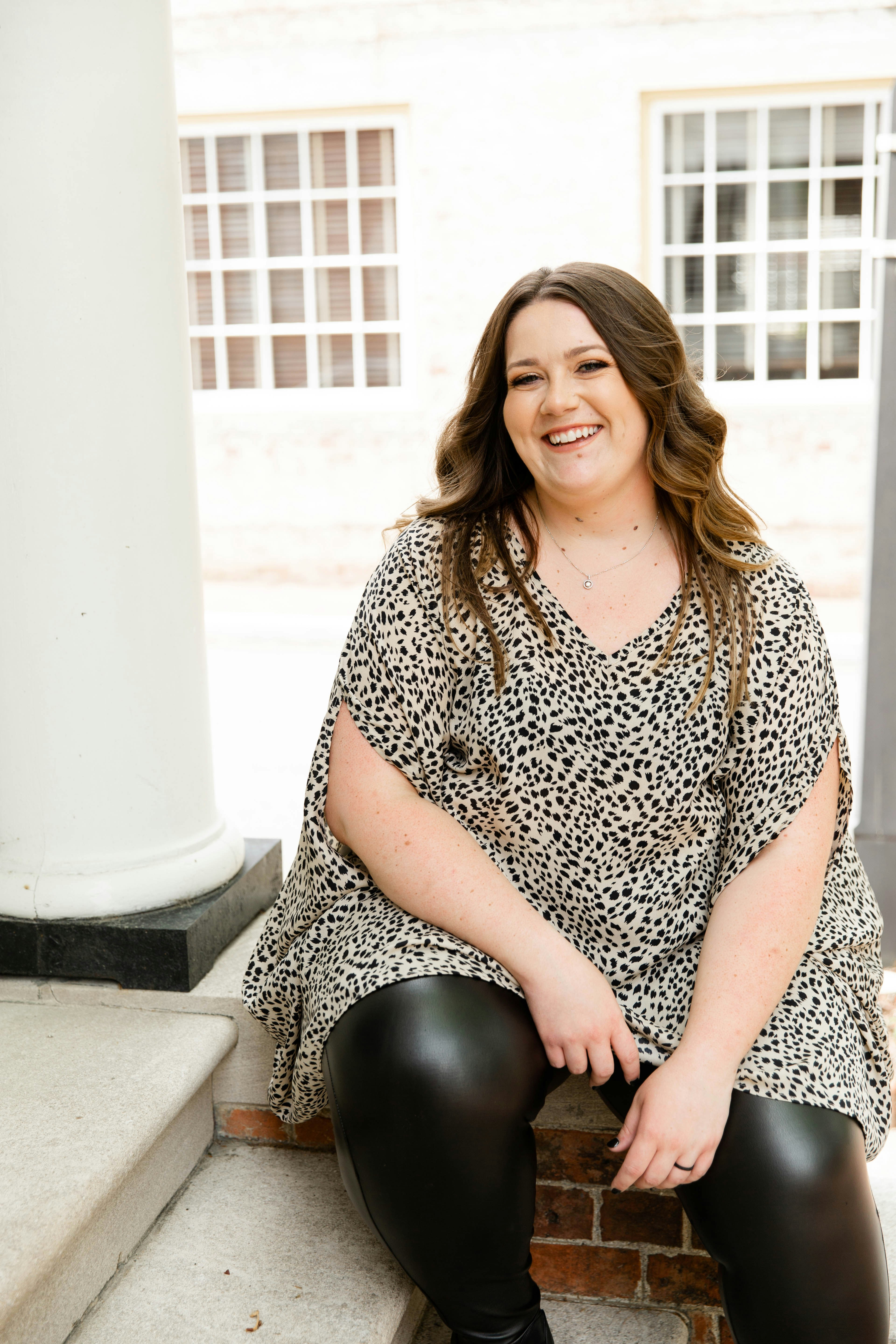 A happy plus-size woman | Source: Unsplash