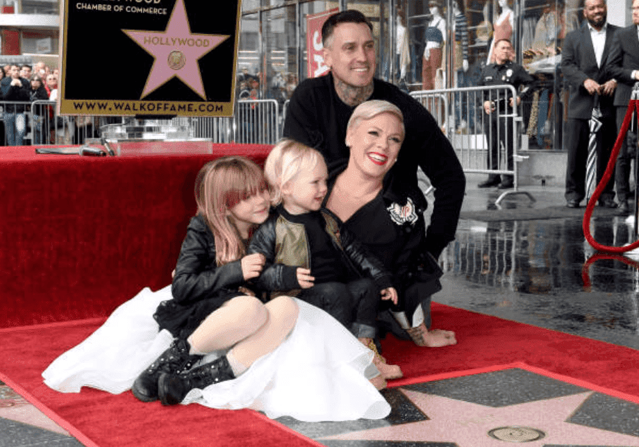 Pink, Carey Hart and their children Willow Sage Hart and Jameson Moon Hart pose on the red carpet in front of the star at the ceremony honoring Pink with Star on the Hollywood Walk of Fame, on February 05, 2019 in Hollywood, California. | Source: Getty Images (Photo by Axelle/Bauer-Griffin/FilmMagic)