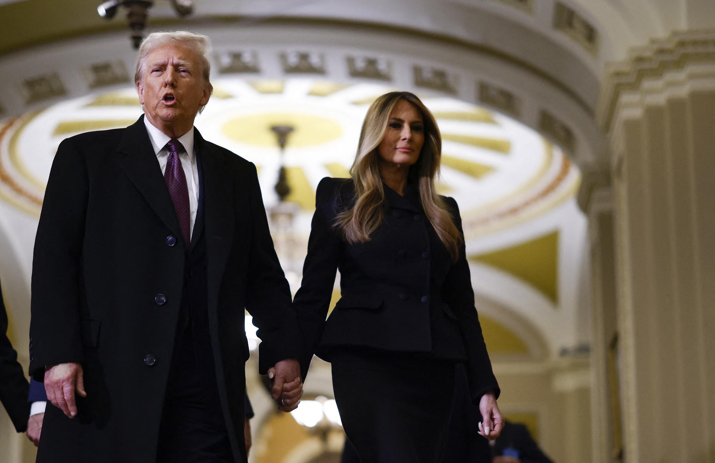 Donald and Melania Trump paying their respects in front of the flag-draped casket of former President Jimmy Carter at the U.S. Capitol Rotunda in Washington, DC, on January 8, 2025. | Source: Getty Images