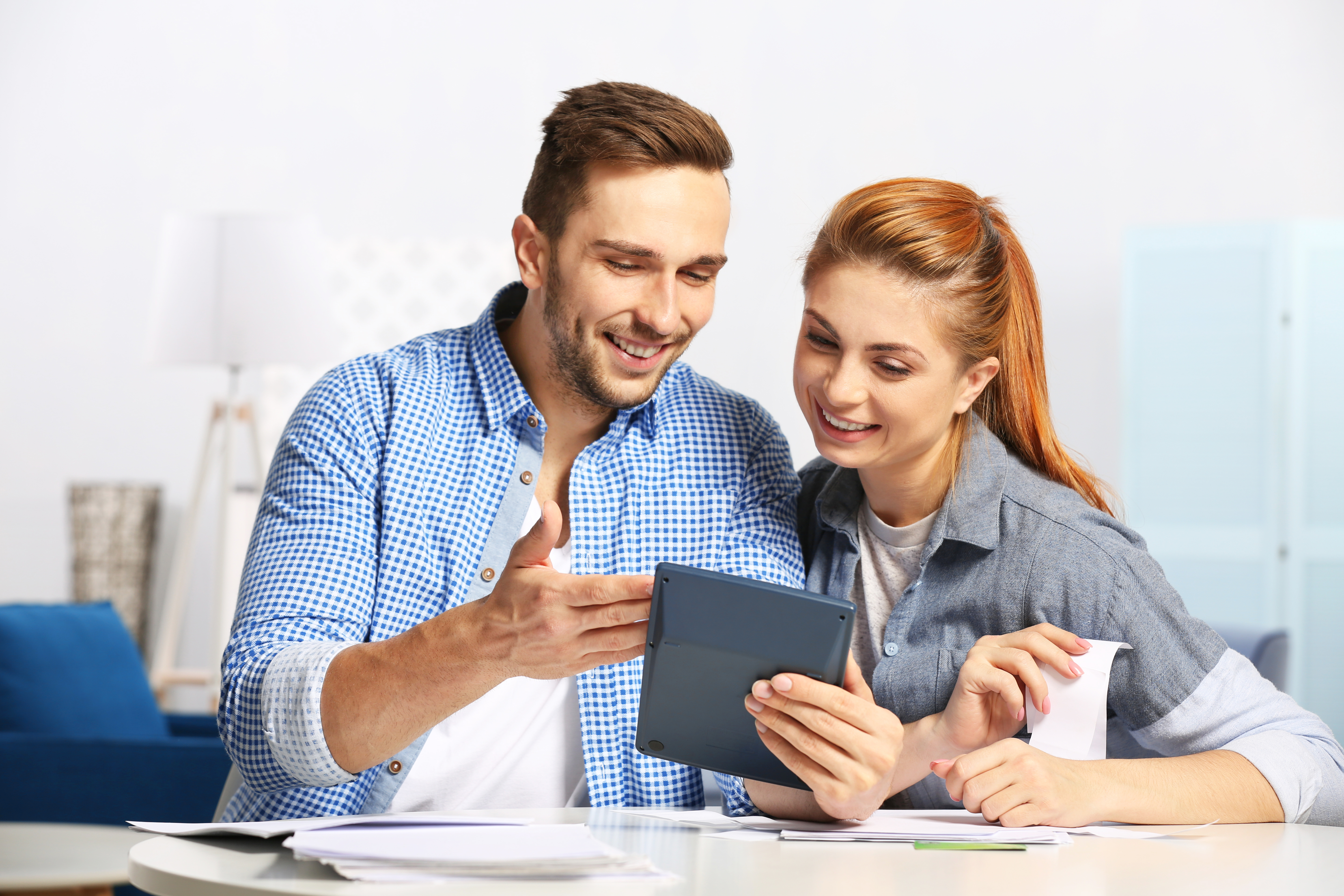 Husband and wife planning budget together | Source: Shutterstock